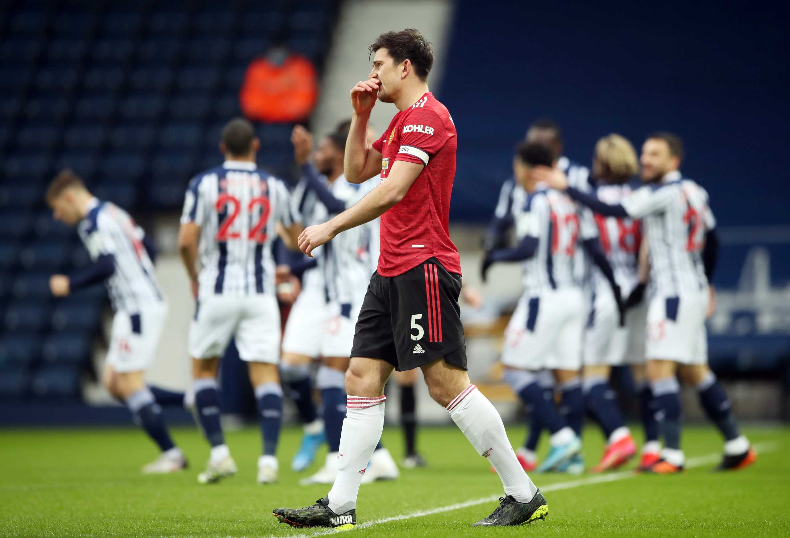 Soccer Football - Premier League - West Bromwich Albion v Manchester United - The Hawthorns, West Bromwich, Britain - February 14, 2021 Manchester United's Harry Maguire reacts after conceding their first goal scored by West Bromwich Albion's Mbaye Diagne Pool via REUTERS