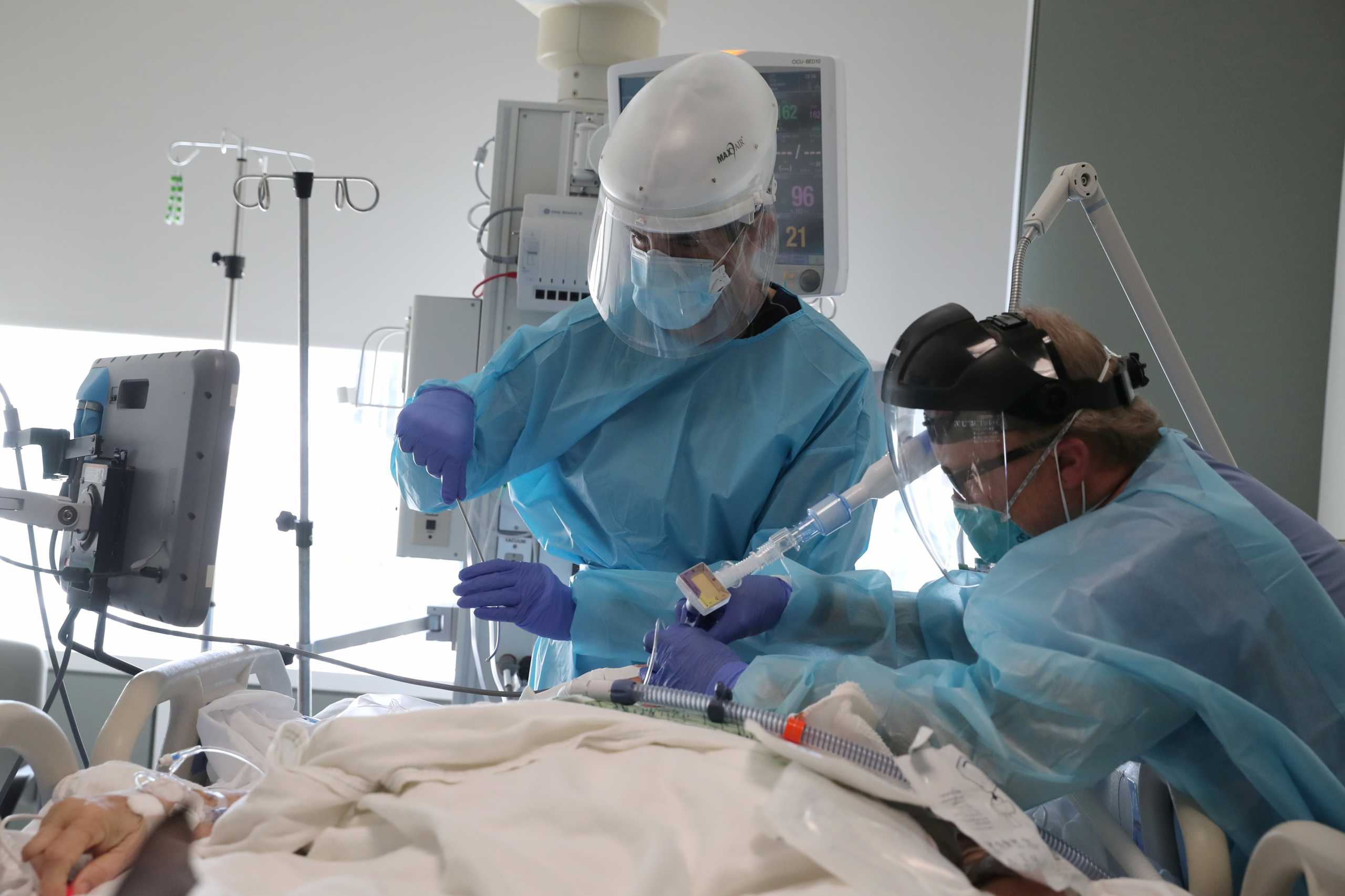 FILE PHOTO: Dr. Gabriel Gomez, 40, intubates a coronavirus disease (COVID-19) patient in the COVID-19 ICU at Providence Mission Hospital in Mission Viejo, California, U.S., January 8, 2021. REUTERS