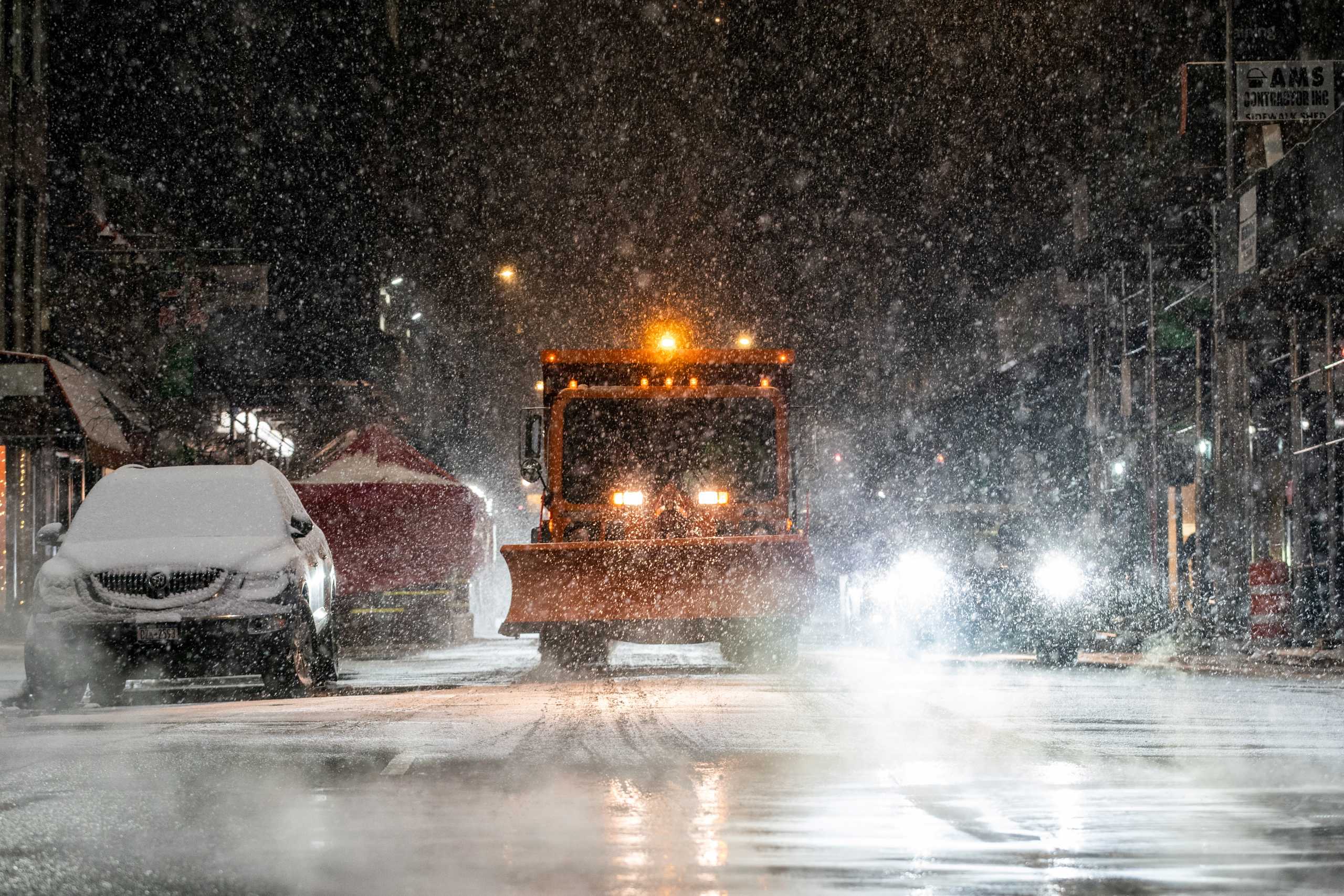A snow plow is seen  as snow begins to fall in Times Square during a snow storm, during the coronavirus disease (COVID-19) pandemic in the Manhattan borough of New York City, New York, U.S., January 31, 2021. REUTERS