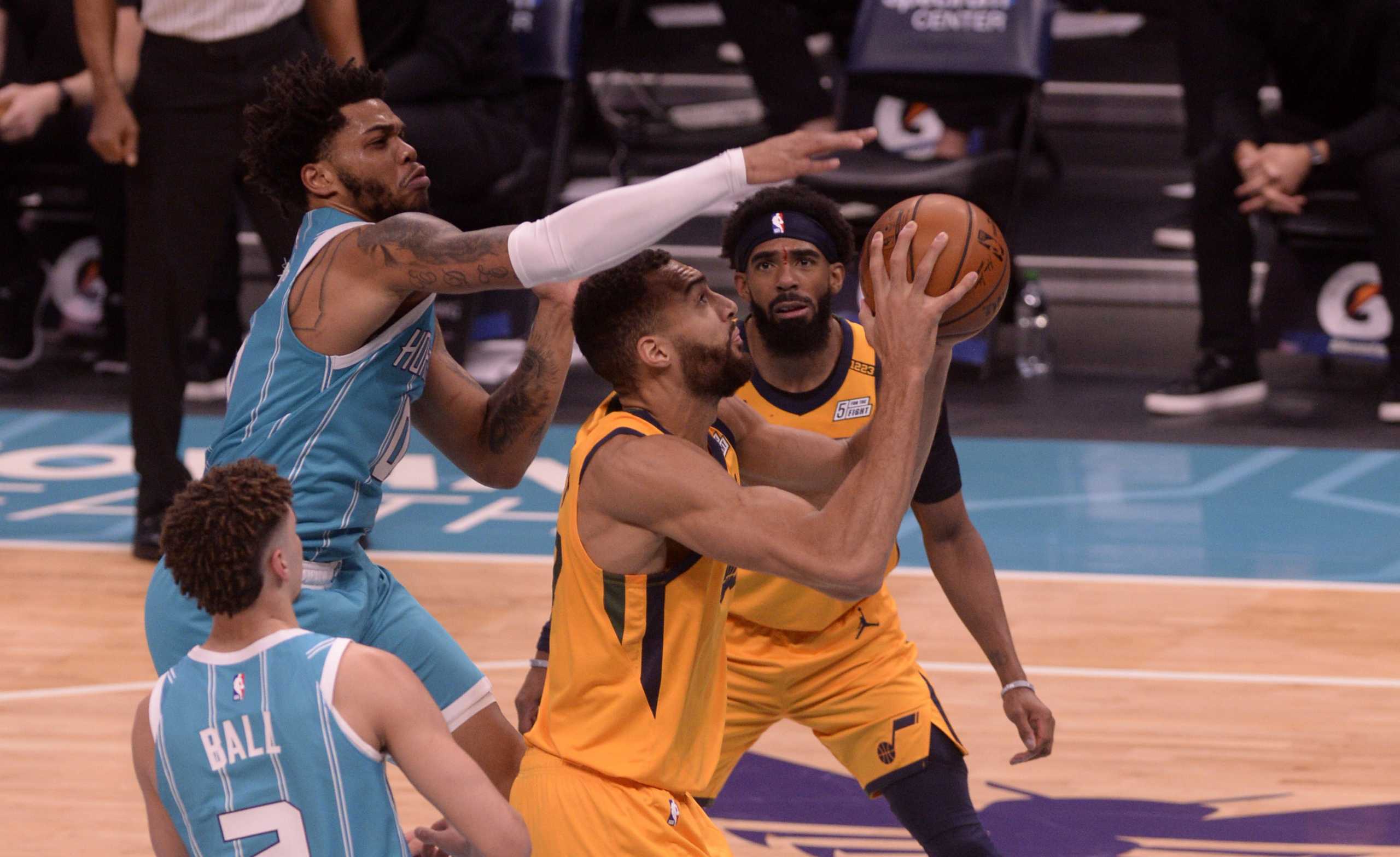 Feb 5, 2021; Charlotte, North Carolina, USA; Charlotte Hornets forward Miles Bridges (0) defends against Utah Jazz center Rudy Gobert (27)  during the second half at the Spectrum Center. Jazz win 138-121. Mandatory Credit: Sam Sharpe-USA TODAY Sports