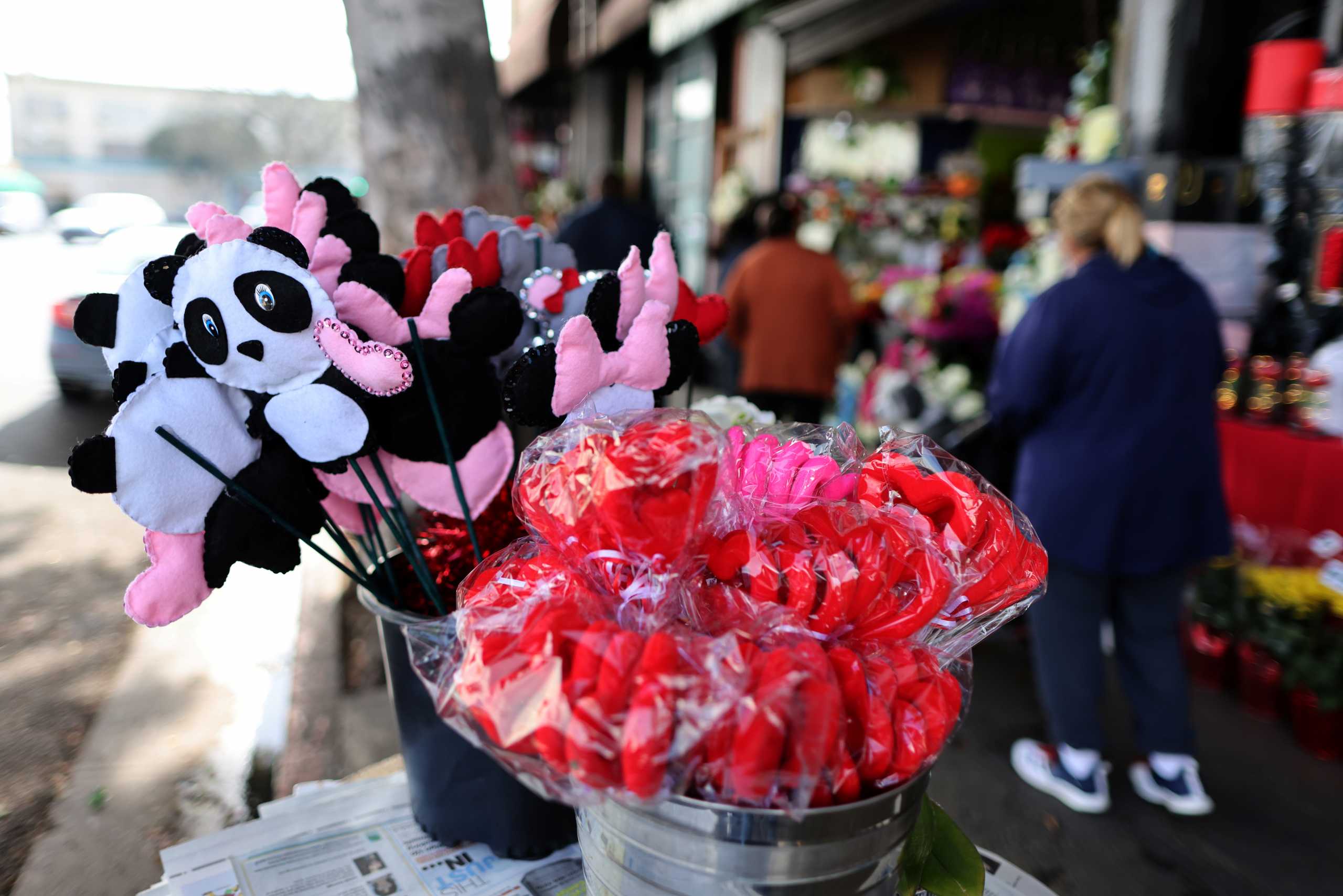 People shop for flowers, as the coronavirus disease (COVID-19) outbreak continues, ahead of Valentine's Day in Los Angeles, California, U.S., February 4, 2021. REUTERS