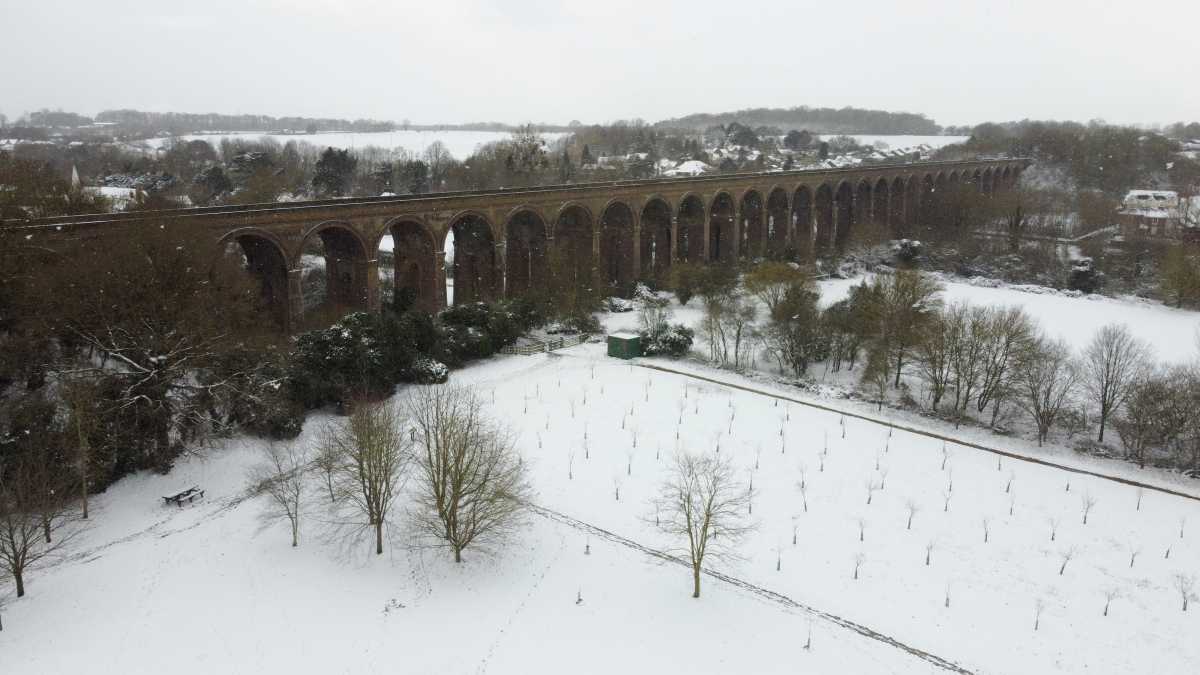 A snow-covered field at Chappel Viaduct in Essex, Britain February 9, 2021. Picture taken with a drone. REUTERS