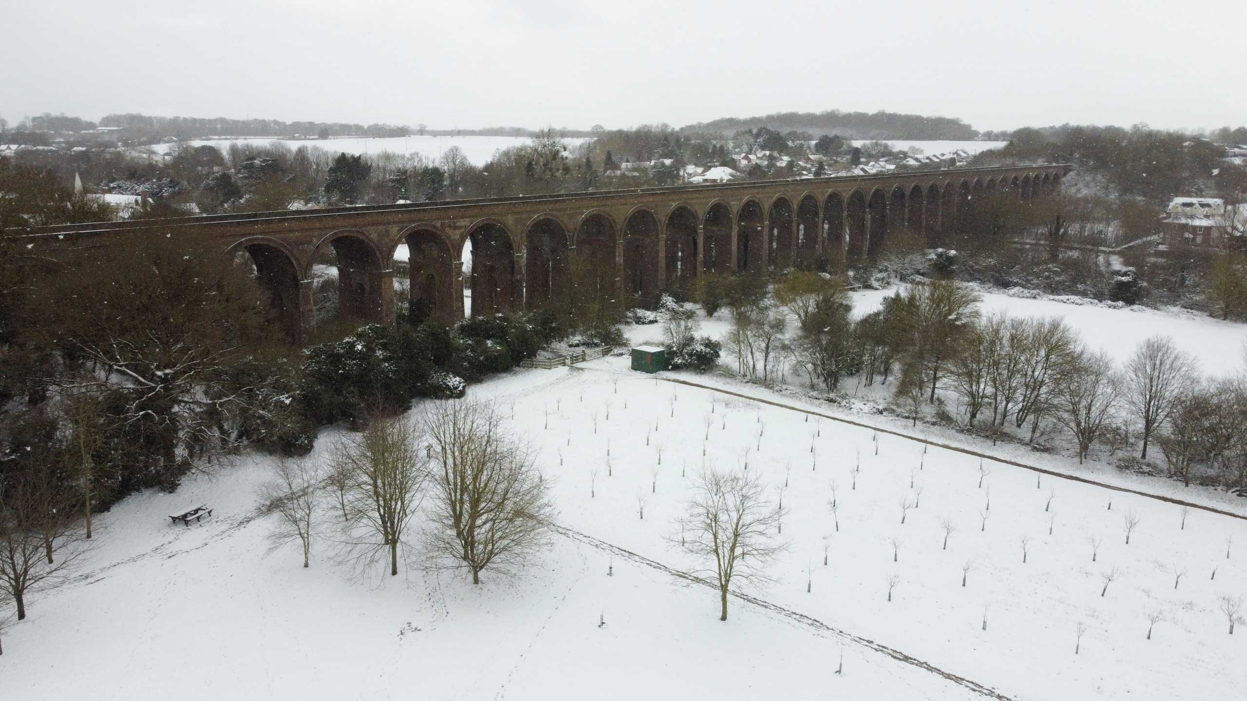 A snow-covered field at Chappel Viaduct in Essex, Britain February 9, 2021. Picture taken with a drone. REUTERS