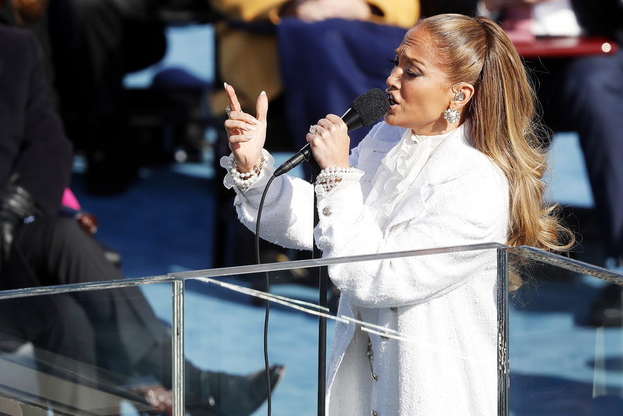 epaselect epa08952824 US singer Jennifer Lopez sings 'This Land is Your Land' during the inaugural ceremony for President-elect Joe Biden and Vice President-elect Kamala Harris on the West Front of the U.S. Capitol in Washington, DC, USA, 20 January 2021. Biden won the 03 November 2020 election to become the 46th President of the United States of America.  EPA