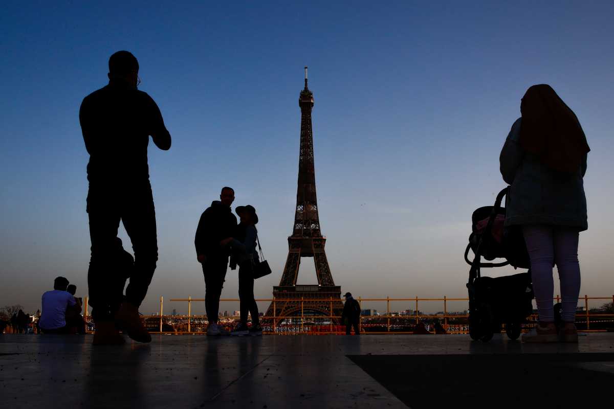 People take pictures at the Trocadero square near the Eiffel tower in Paris amid the coronavirus disease (COVID-19) outbreak in France, March 2, 2021. REUTERS