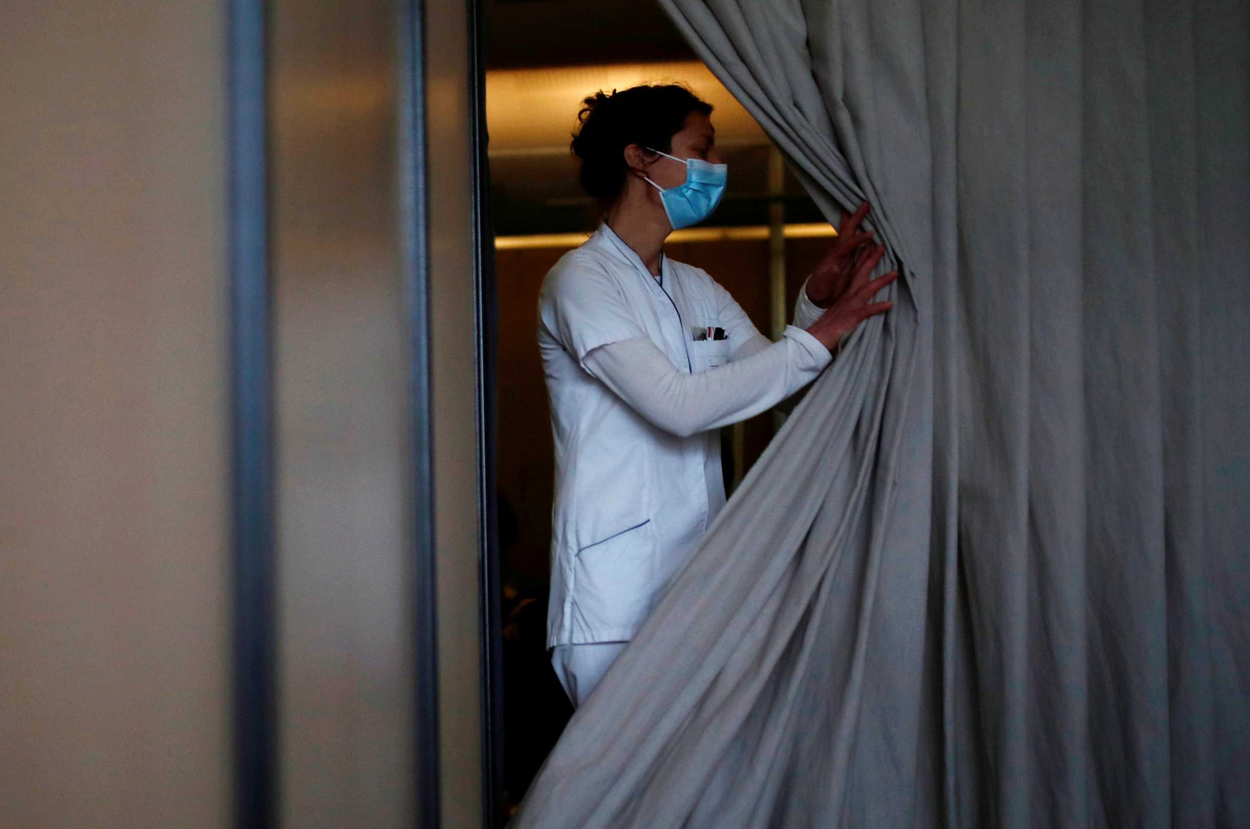 A healthcare staff member works in a vaccination center at the Confluent Hospital in Nantes, as part of the coronavirus disease (COVID-19) vaccination campaign in France, March 18, 2021. REUTERS