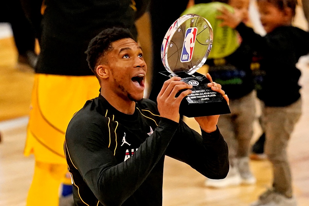 Mar 7, 2021; Atlanta, Georgia, USA;  Team LeBron forward Giannis Antetokounmpo of the Milwaukee Bucks (34)  reacts to being named the MVP of the 2021 NBA All-Star Game at State Farm Arena. Mandatory Credit: Dale Zanine-USA TODAY Sports