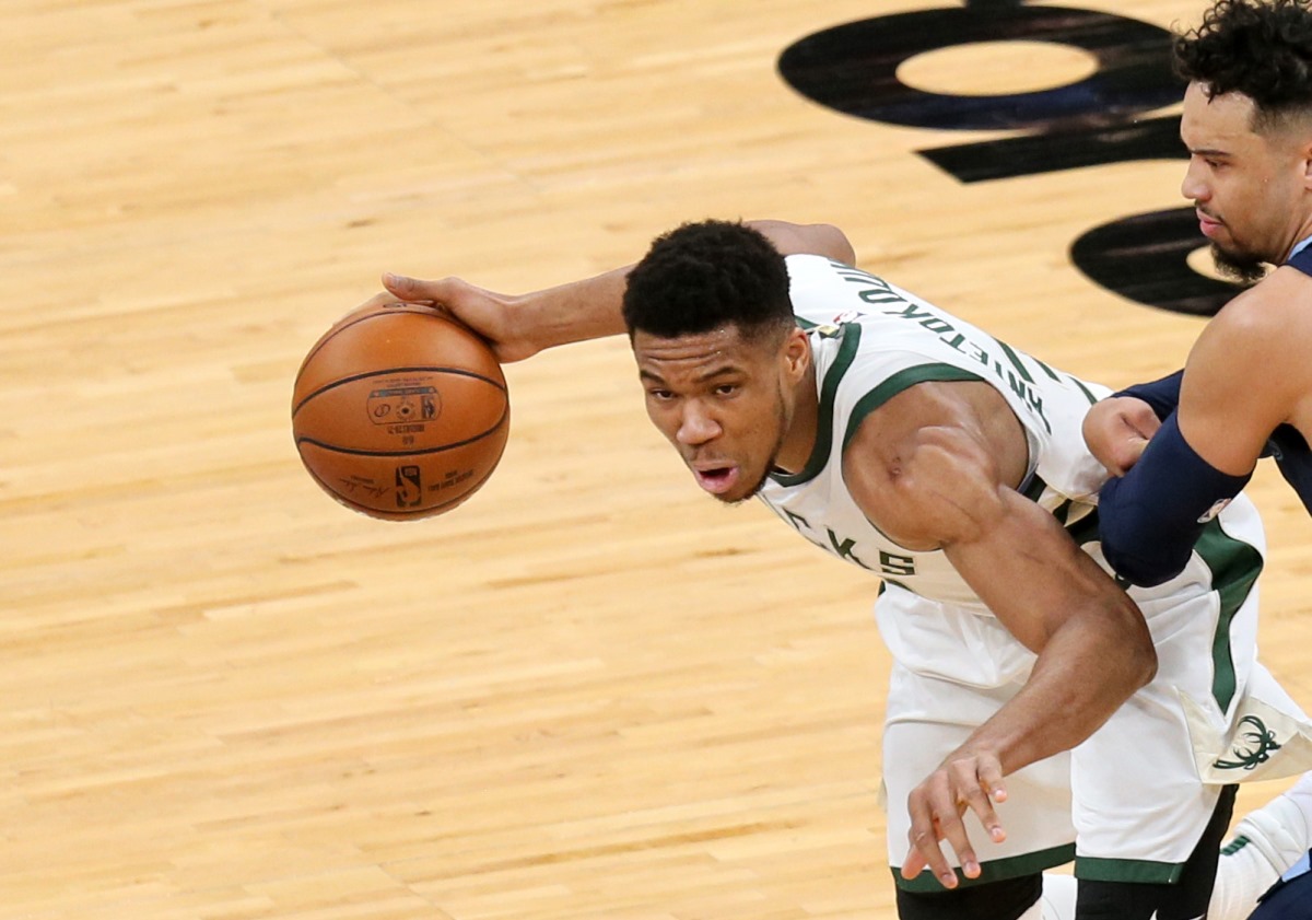 Mar 4, 2021; Memphis, Tennessee, USA; Milwaukee Bucks forward Giannis Antetokounmpo (34) drives against Memphis Grizzlies guard Dillon Brooks (24) in the first quarter at FedExForum. Mandatory Credit: Nelson Chenault-USA TODAY Sports