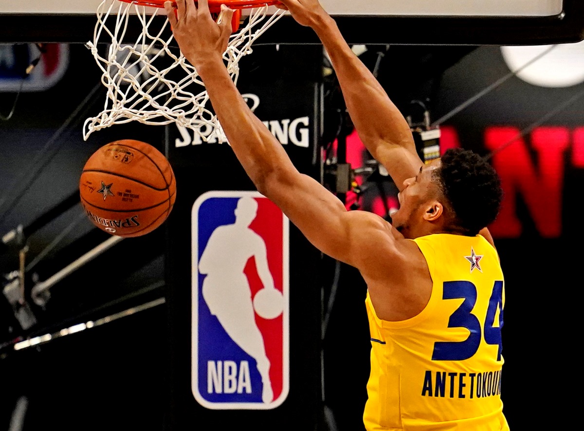 Mar 7, 2021; Atlanta, Georgia, USA;  Team LeBron forward Giannis Antetokounmpo of the Milwaukee Bucks (34)  dunks the ball against Team Durant forward Jayson Tatum of the Boston Celtics (0) during the 2021 NBA All-Star Game at State Farm Arena. Mandatory Credit: Dale Zanine-USA TODAY Sports