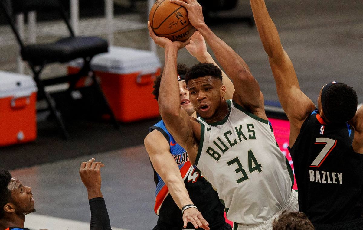Feb 19, 2021; Milwaukee, Wisconsin, USA;  Milwaukee Bucks forward Giannis Antetokounmpo (34) passes the ball during the second quarter against the Oklahoma City Thunder at Fiserv Forum. Mandatory Credit: Jeff Hanisch-USA TODAY Sports