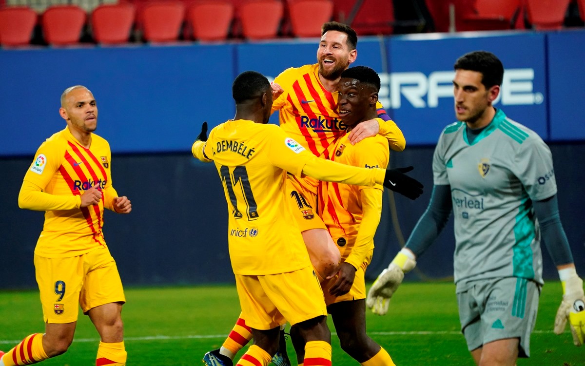 Soccer Football - La Liga Santander - Osasuna v FC Barcelona - El Sadar Stadium, Pamplona, Spain - March 6, 2021 Barcelona's Ilaix Moriba celebrates scoring their second goal with Lionel Messi, Ousmane Dembele and Martin Braithwaite as Osasuna's Sergio Herrera looks dejected REUTERS