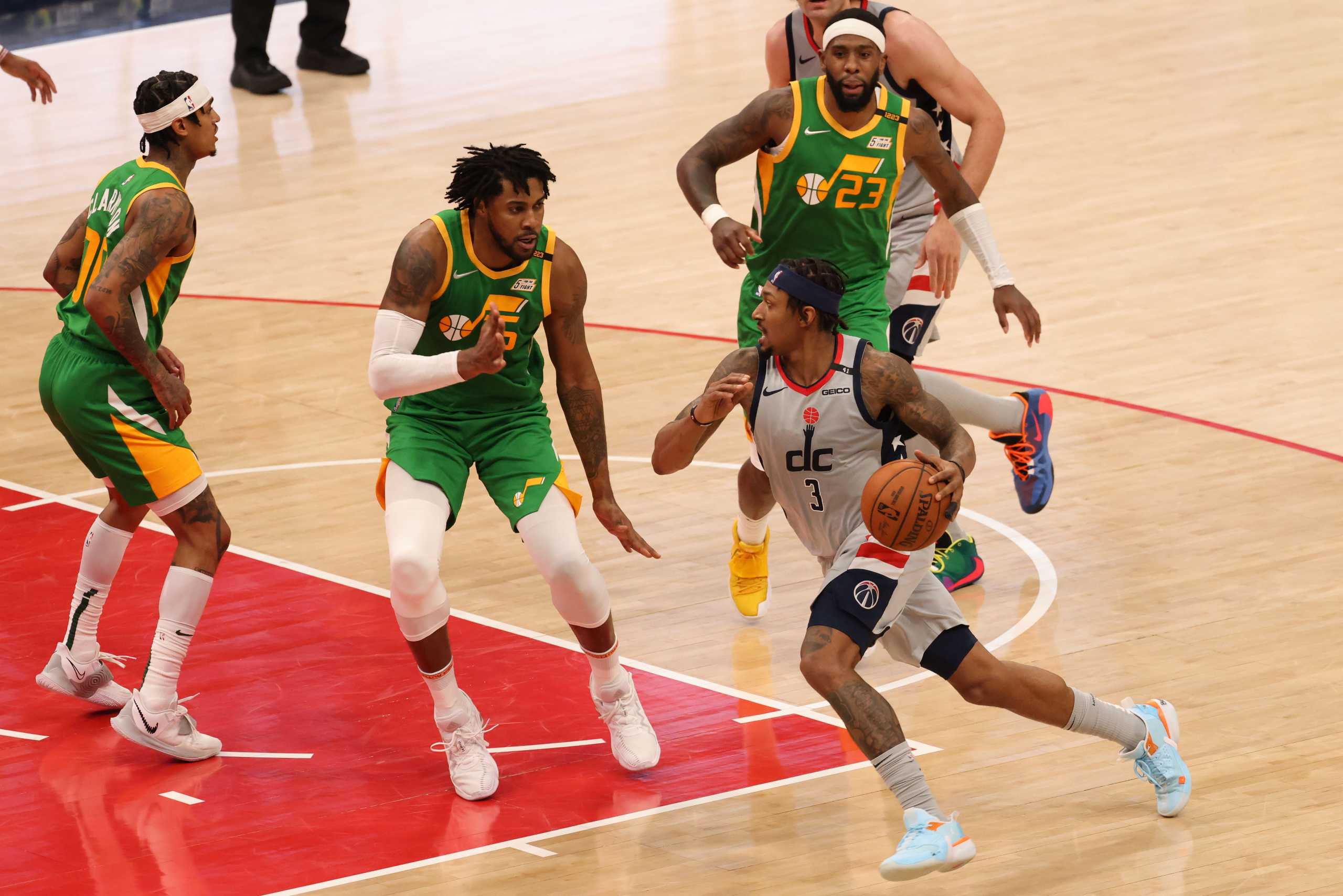 Mar 18, 2021; Washington, District of Columbia, USA; Washington Wizards guard Bradley Beal (3) drives to the basket as Utah Jazz forward Derrick Favors (15) defends in the fourth quarter at Capital One Arena. Mandatory Credit: Geoff Burke-USA TODAY Sports