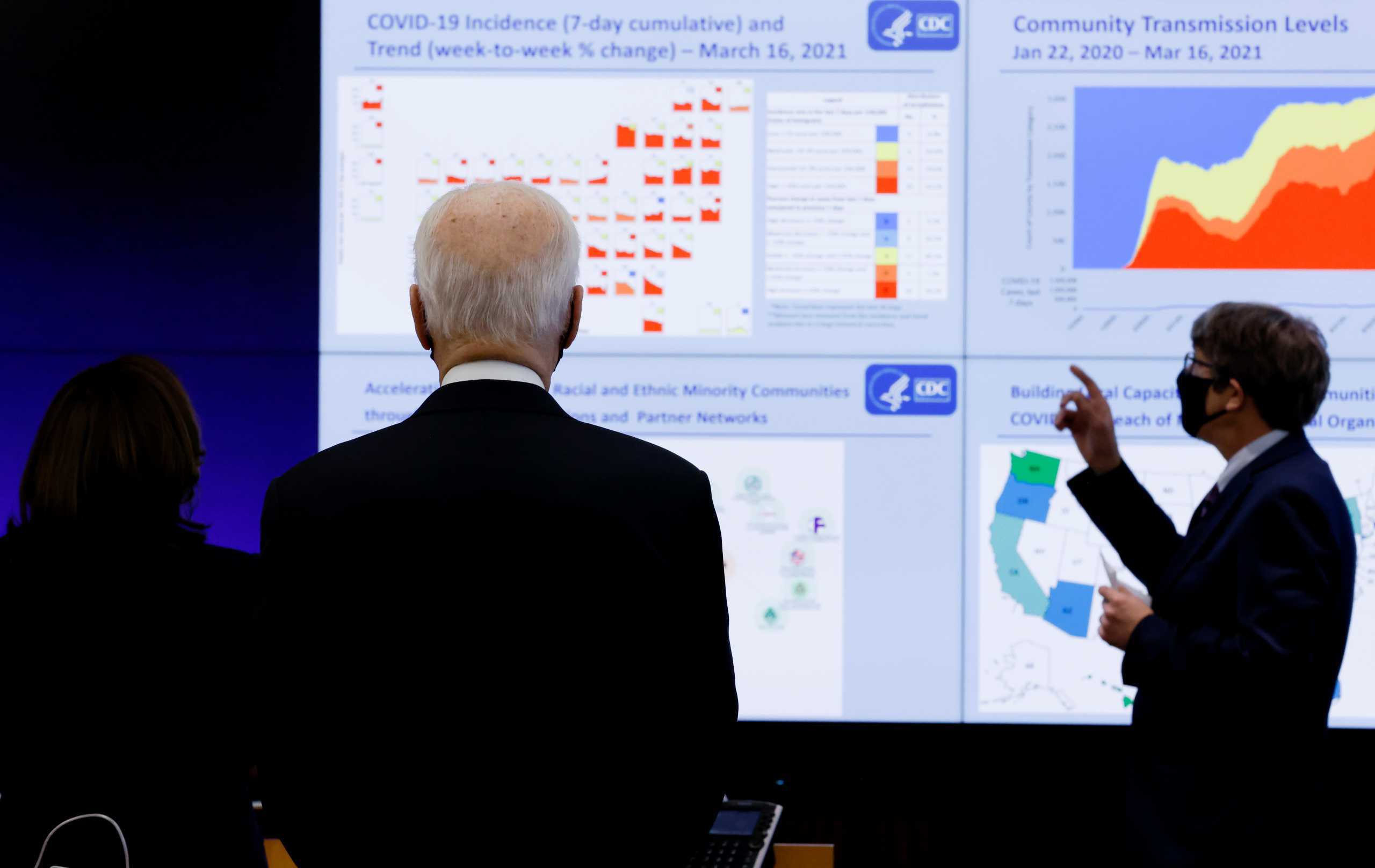 U.S. President Joe Biden and Vice President Kamala Harris view a chart while receiving an update on the fight against the coronavirus disease (COVID-19) pandemic as they visit the Centers for Disease Control and Prevention (CDC) in Atlanta, Georgia, U.S., March 19, 2021. REUTERS
