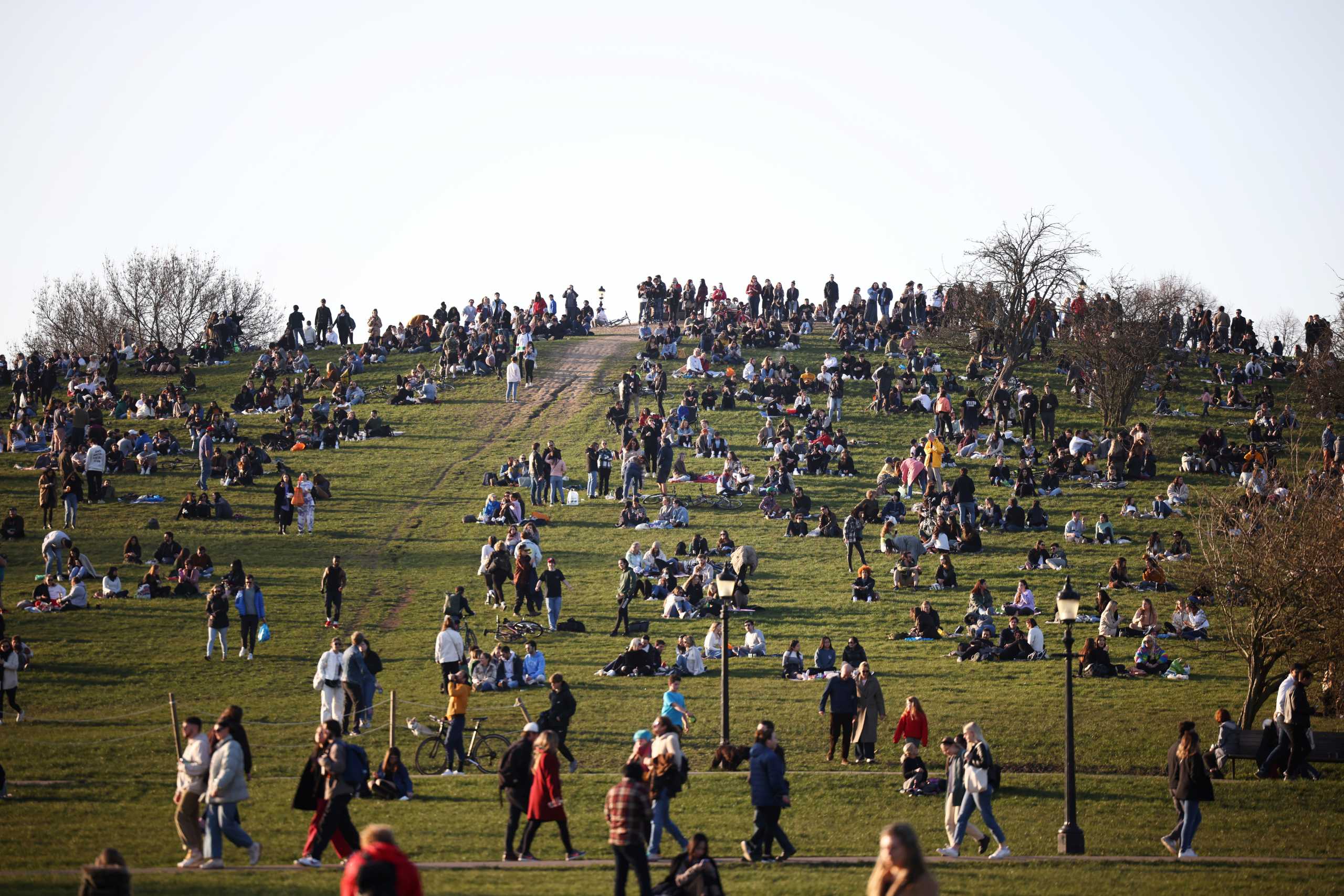 People visit Primrose Hill, amid the coronavirus disease (COVID-19) outbreak, in London, Britain, February 27, 2021.  REUTERS