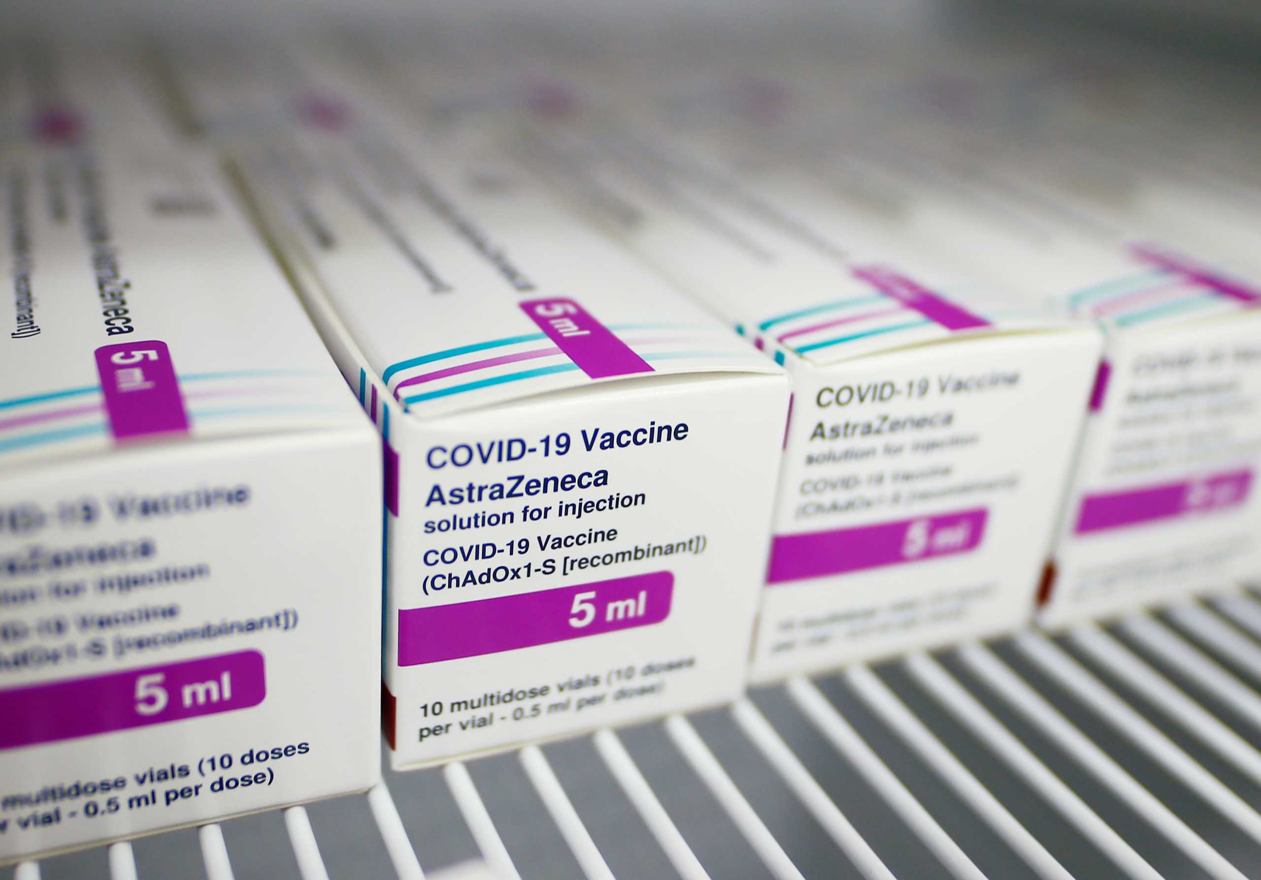Packages of AstraZeneca's COVID-19 vaccine are seen at a vaccination centre, temporarily set up in a hall of the fair, amid the coronavirus disease pandemic in Cologne, Germany, March 18, 2021. REUTERS