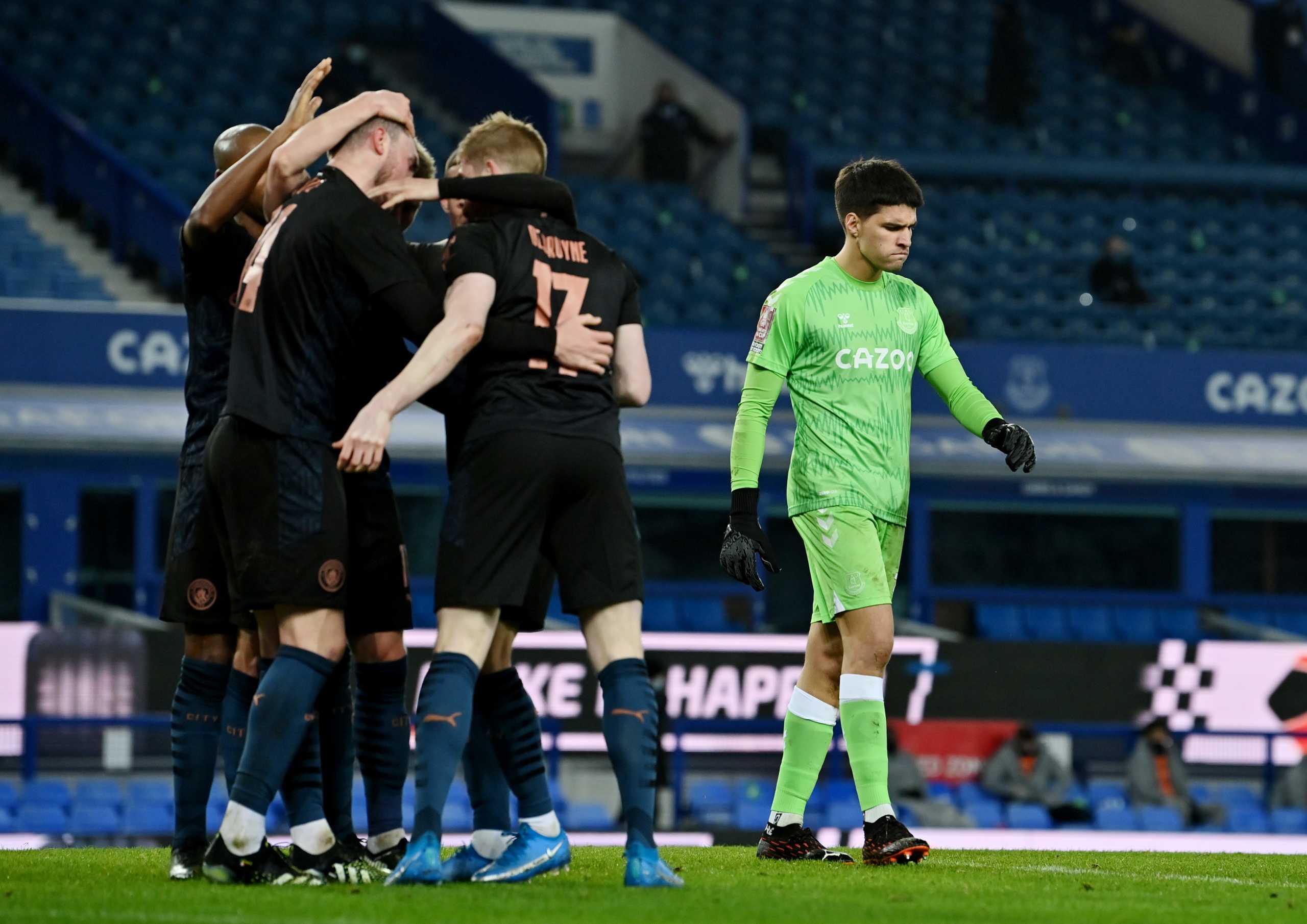 Soccer Football -  FA Cup Quarter Final - Everton v Manchester City - Goodison Park, Liverpool, Britain - March 20, 2021 Manchester City's Ilkay Gundogan celebrates scoring their first goal with teammates Pool via REUTERS