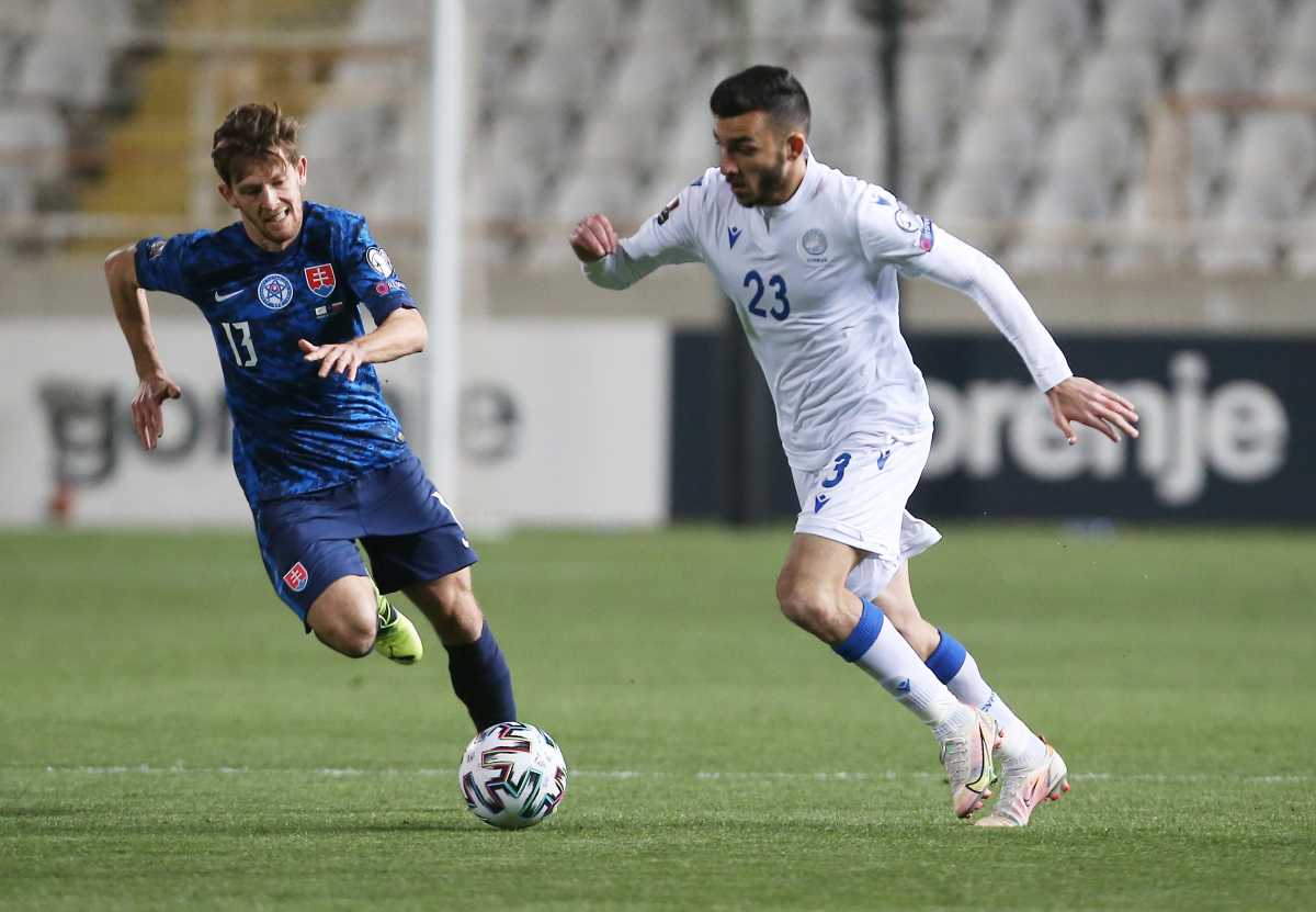 Soccer Football - World Cup Qualifiers Europe - Group H - Cyprus v Slovakia - GSP Stadium, Strovolos, Cyprus - March 24, 2021 Cyprus' Ioannis Pittas in action with Slovakia's Patrik Hrosovsky REUTERS