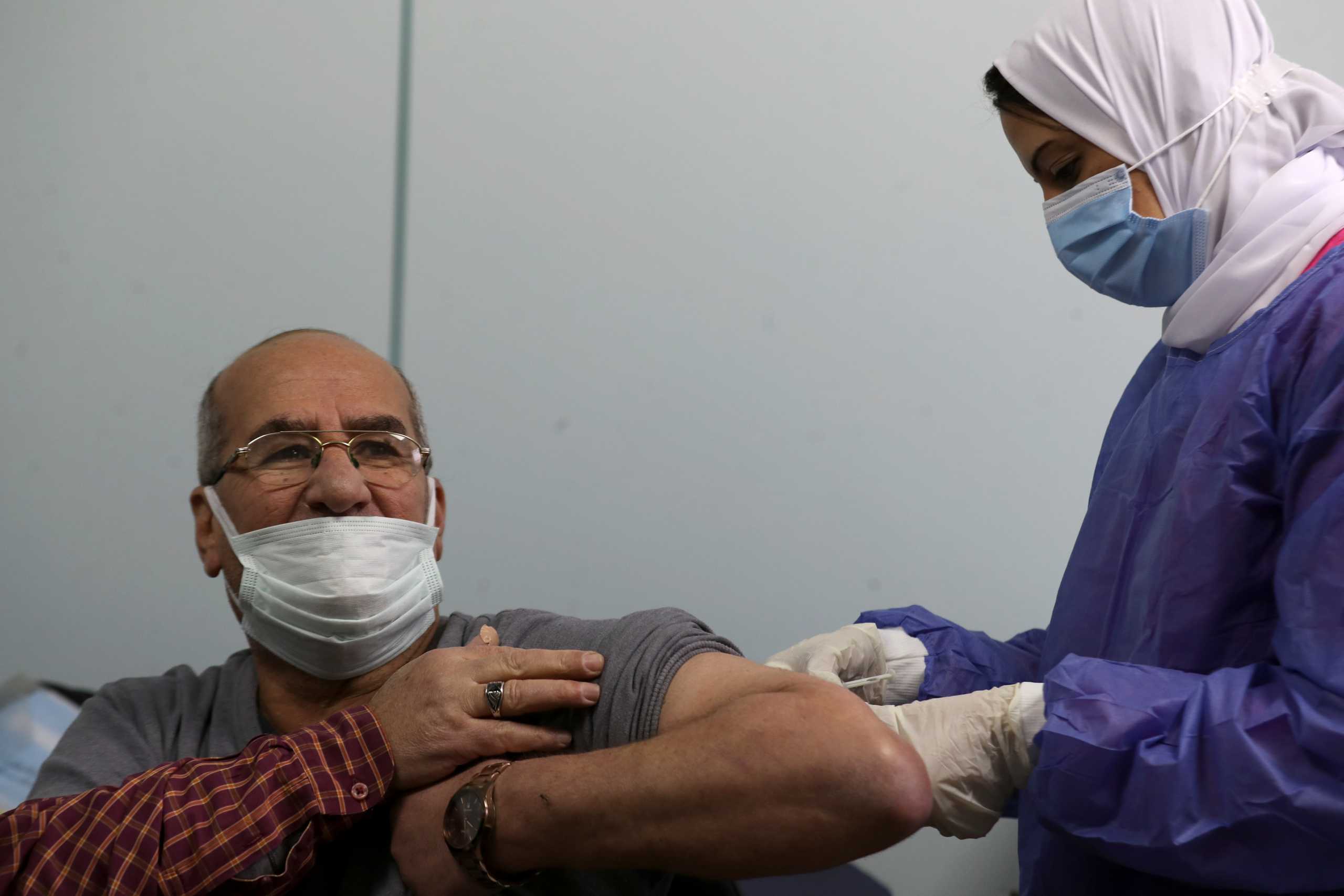 A man receives a dose of a vaccine against the coronavirus disease (COVID-19) in Cairo, Egypt March 4, 2021. REUTERS