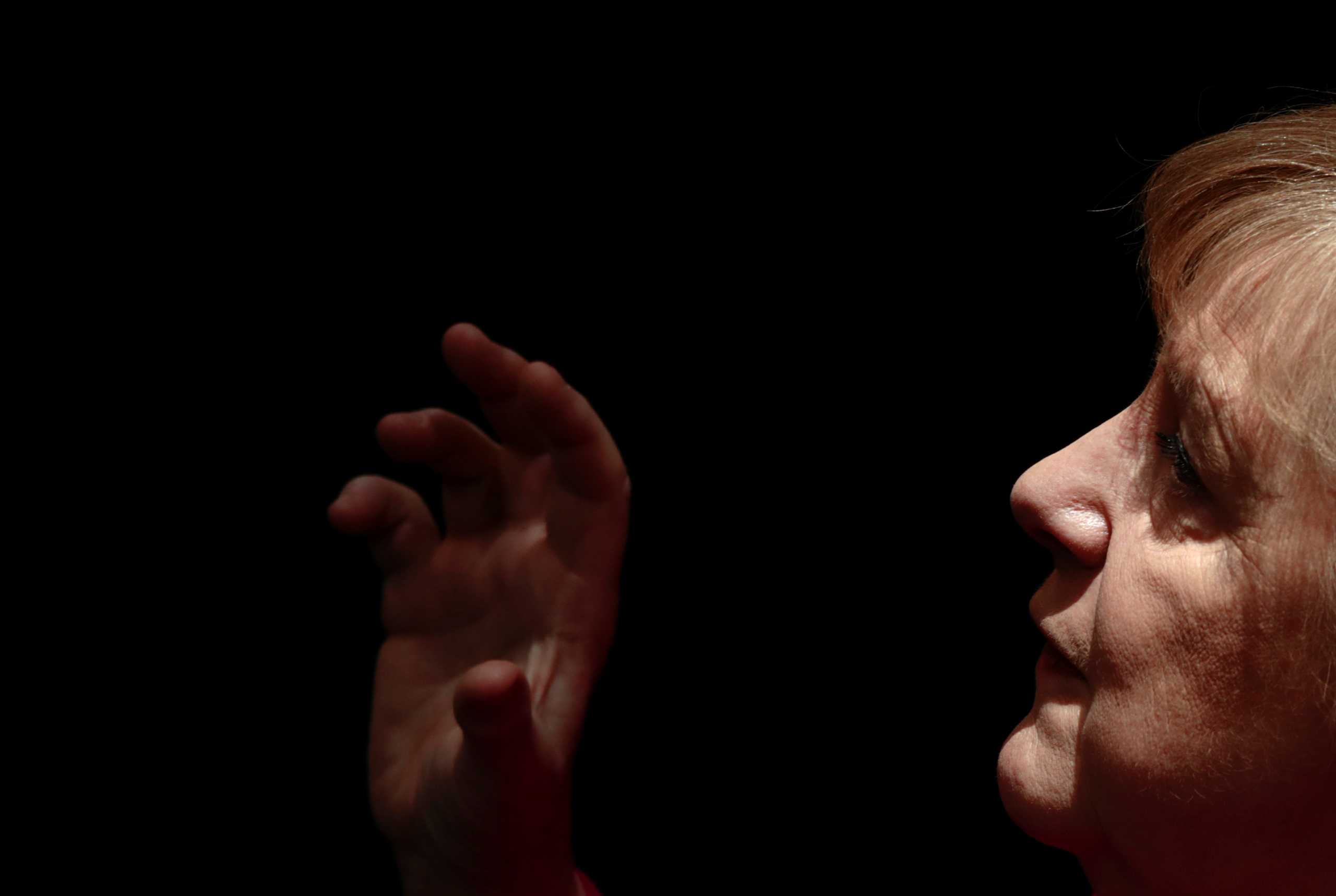 German Chancellor Angela Merkel gestures during a speech at the country's parliament, the Bundestag, in Berlin, Germany, March 25, 2021. REUTERS