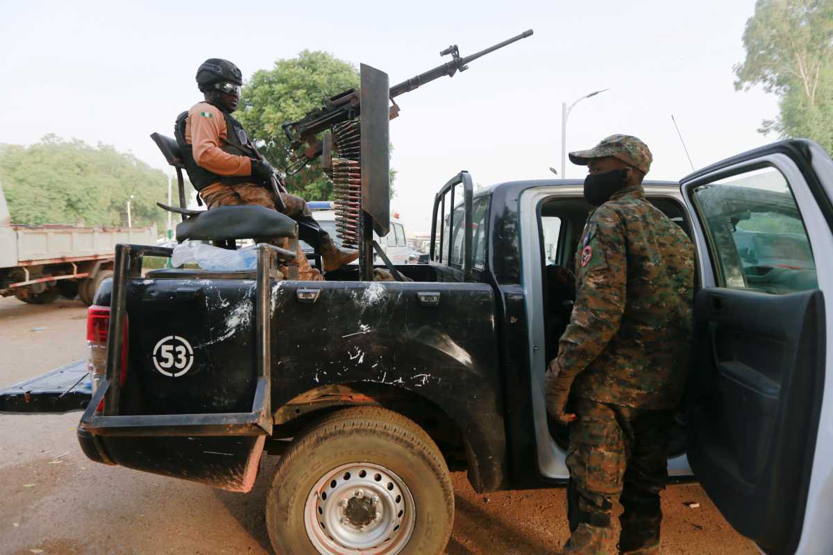 FILE PHOTO: A soldier sits on one of the trucks used to bring back the girls who were kidnapped from a boarding school in the northwest Nigerian state of Zamfara, following their release in Zamfara, Nigeria, March 2, 2021. REUTERS