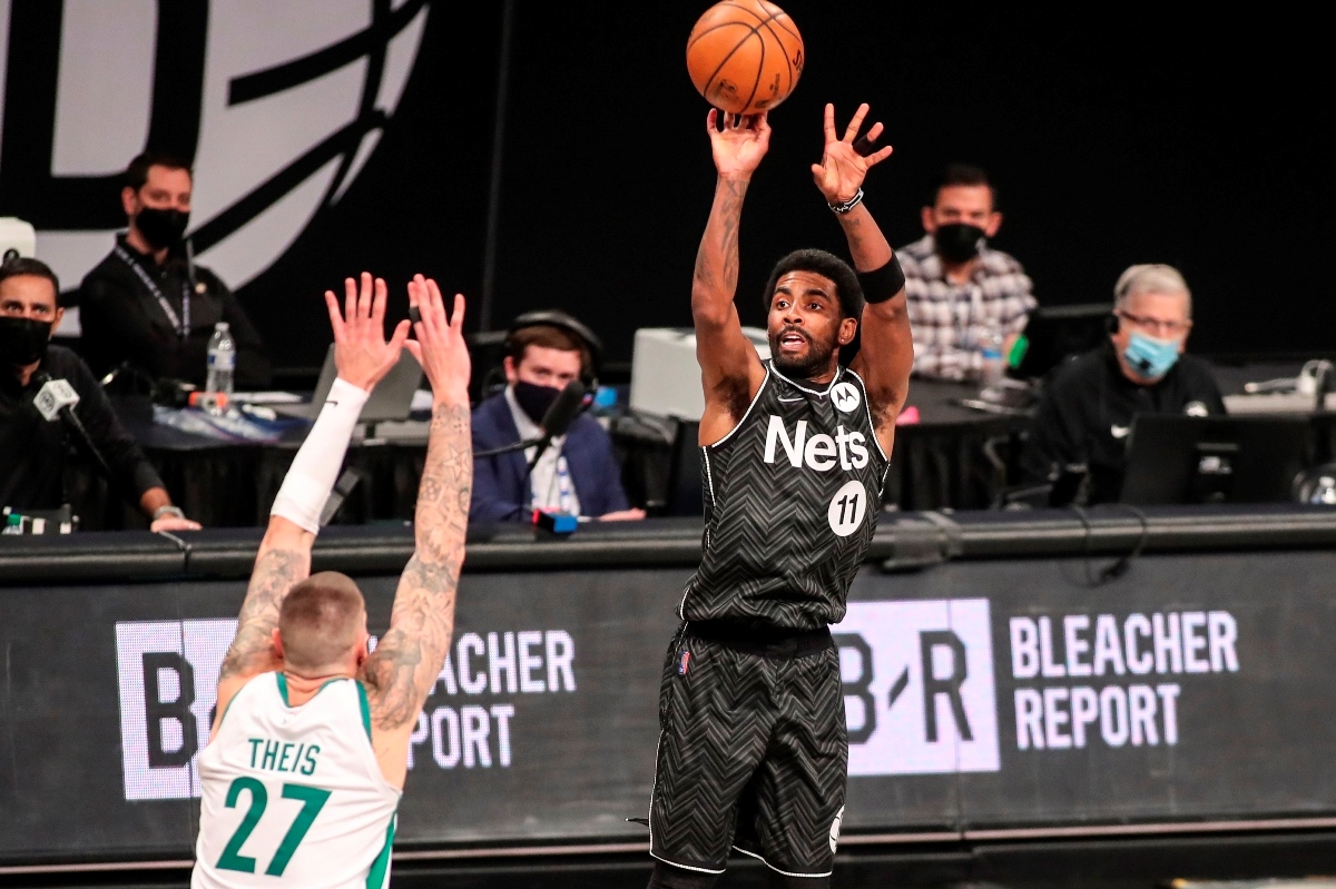Mar 11, 2021; Brooklyn, New York, USA;  Brooklyn Nets guard Kyrie Irving (11) shoots a three point shot in the third quarter against the Boston Celtics at Barclays Center. Mandatory Credit: Wendell Cruz-USA TODAY Sports