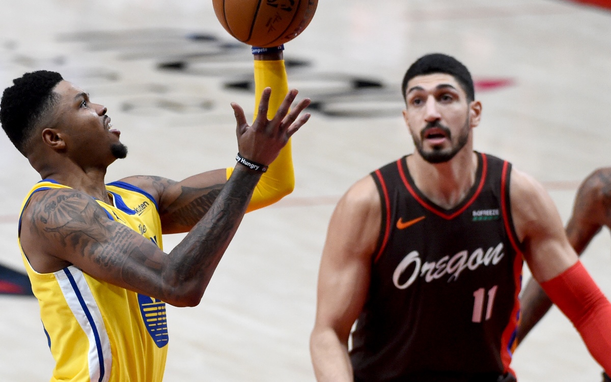 Mar 3, 2021; Portland, Oregon, USA; Golden State Warriors forward Kent Bazemore (26) drives to the basket on Portland Trail Blazers center Enes Kanter (11) during the first quarter of the game at Moda Center. Mandatory Credit: Steve Dykes-USA TODAY Sports