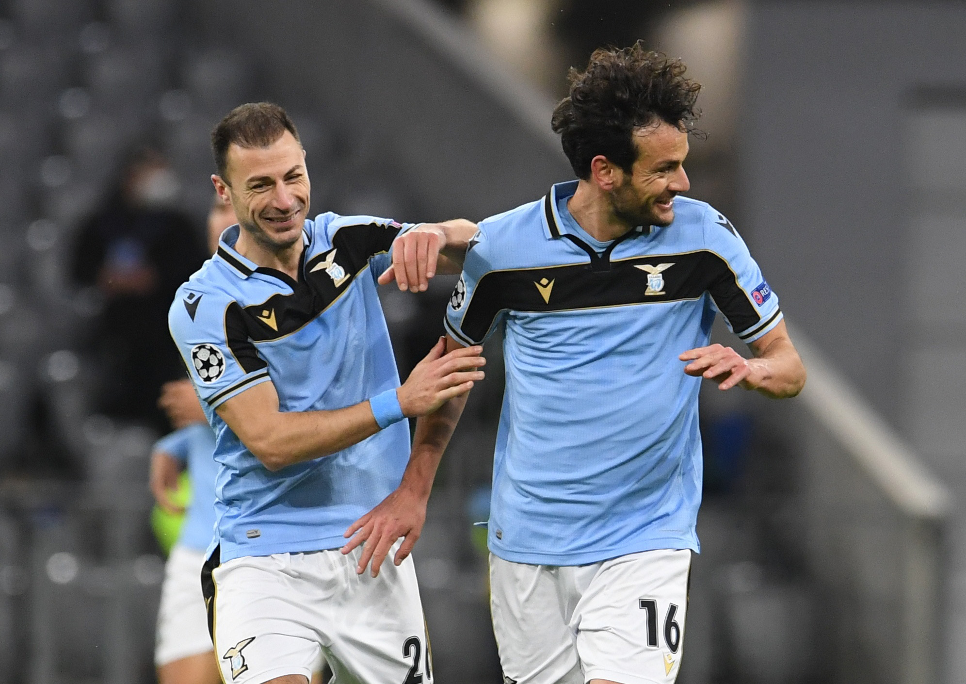 Soccer Football - Champions League - Round of 16 Second Leg - Bayern Munich v Lazio - Allianz Arena, Munich, Germany - March 17, 2021 Lazio's Marco Parolo celebrates scoring their first goal with teammate REUTERS