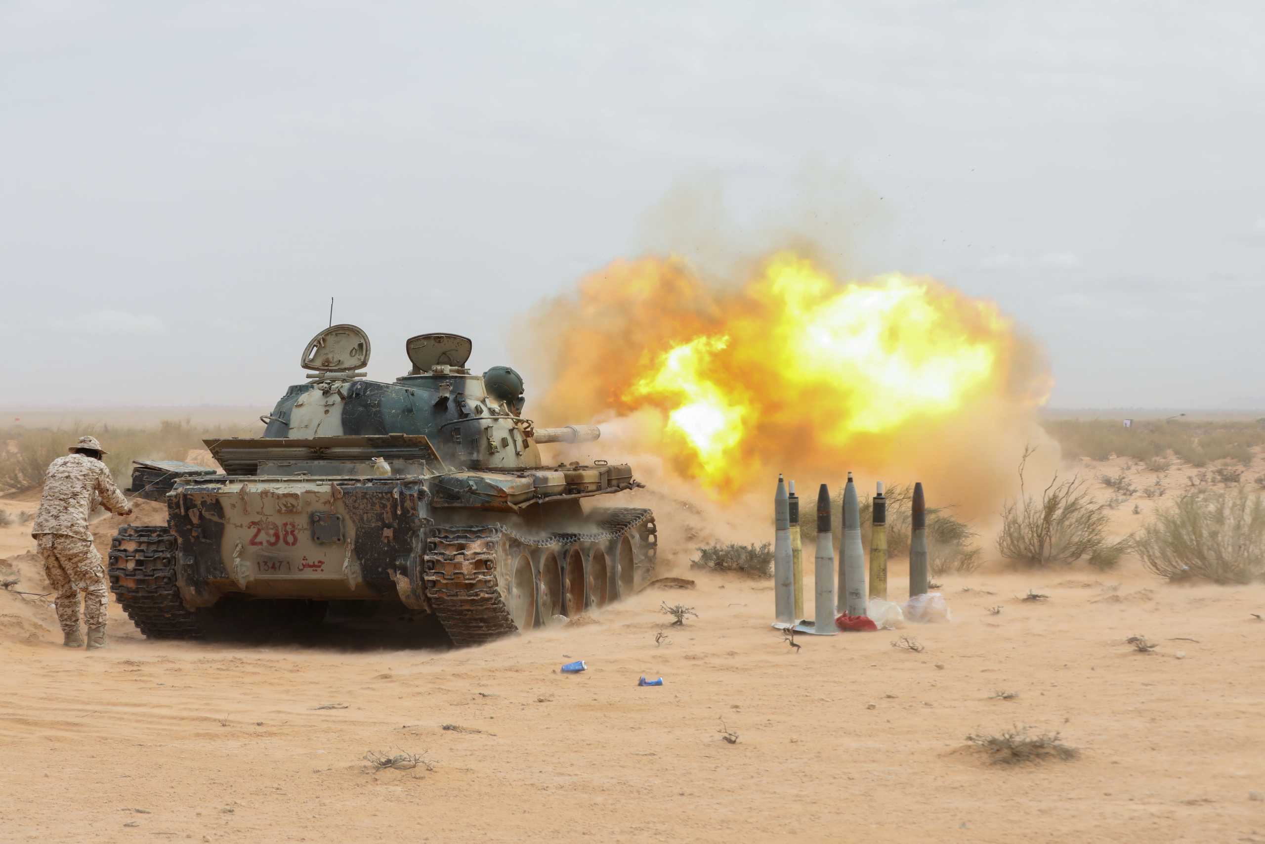 A military vechile fires during a demonstration at a graduation ceremony for members of Libya's Petroleum Facilities Guard ,in Bir al-Ghanam town, Libya, March 22, 2021. REUTERS
