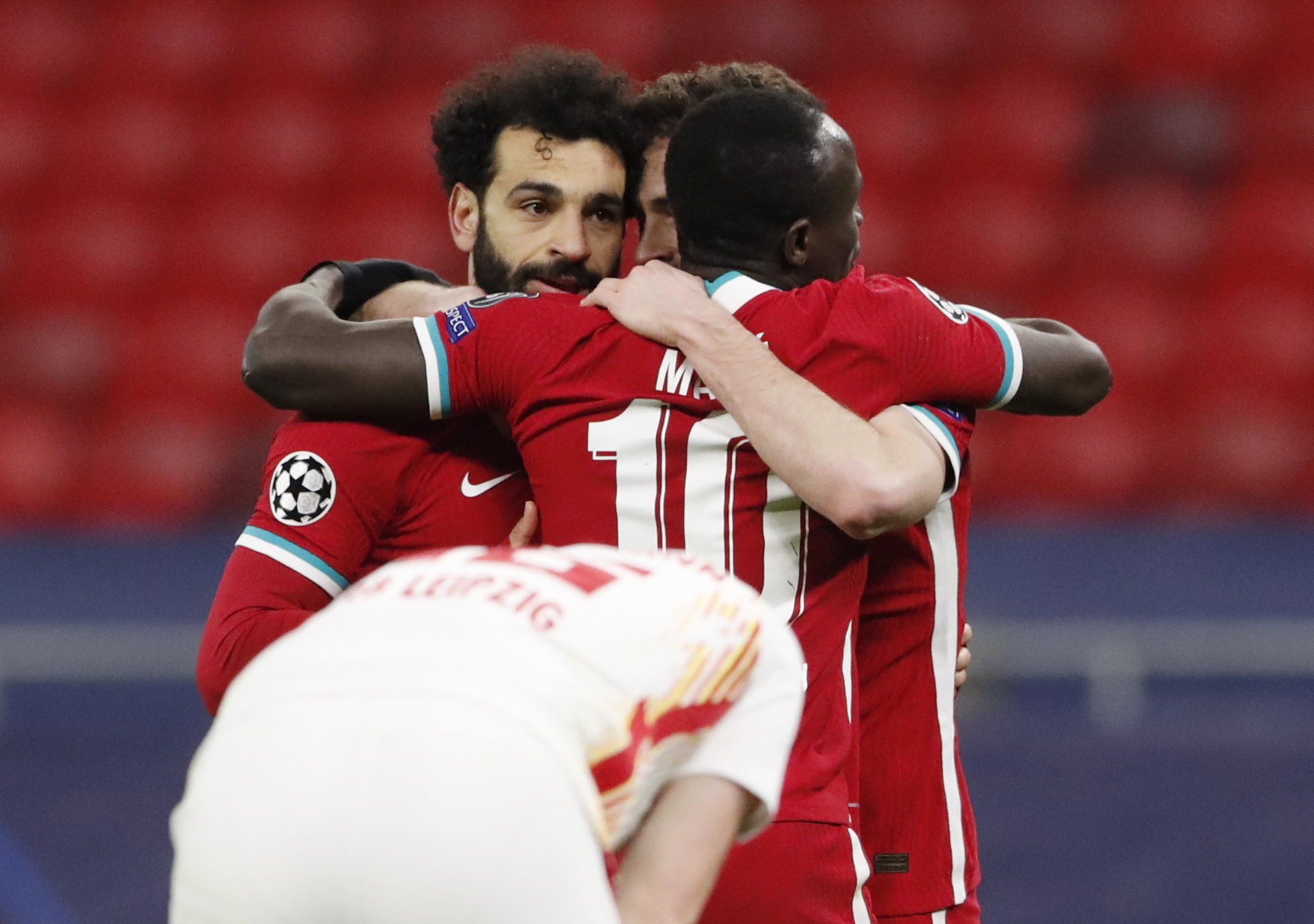 Soccer Football - Champions League - Round of 16 Second Leg - Liverpool v RB Leipzig - Puskas Arena, Budapest, Hungary - March 10, 2021 Liverpool's Mohamed Salah celebrates scoring their first goal with teammates REUTERS