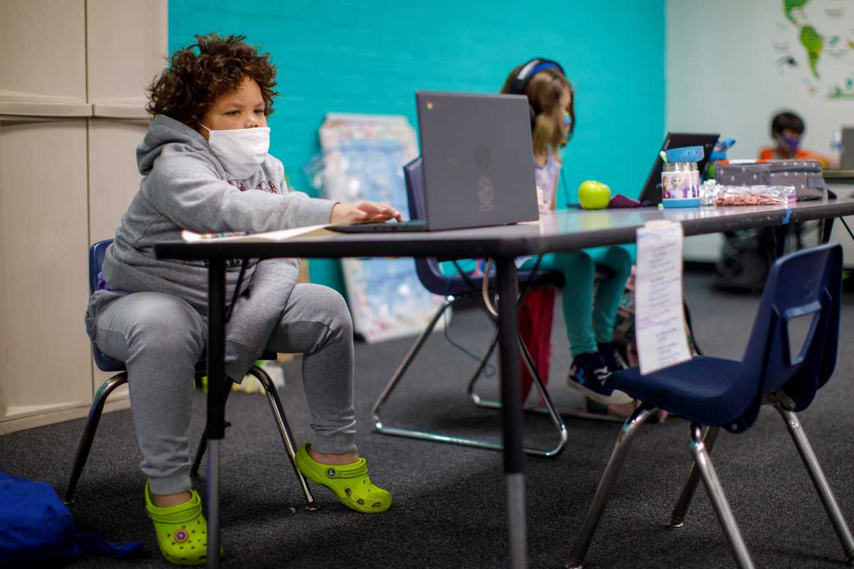 Khayo, 6, takes a zoom class as the Westchester Family YMCA provides a safe distance learning environment for local students during the outbreak of the coronavirus disease (COVID-19) in Los Angeles, California, U.S., March 2, 2021. REUTERS