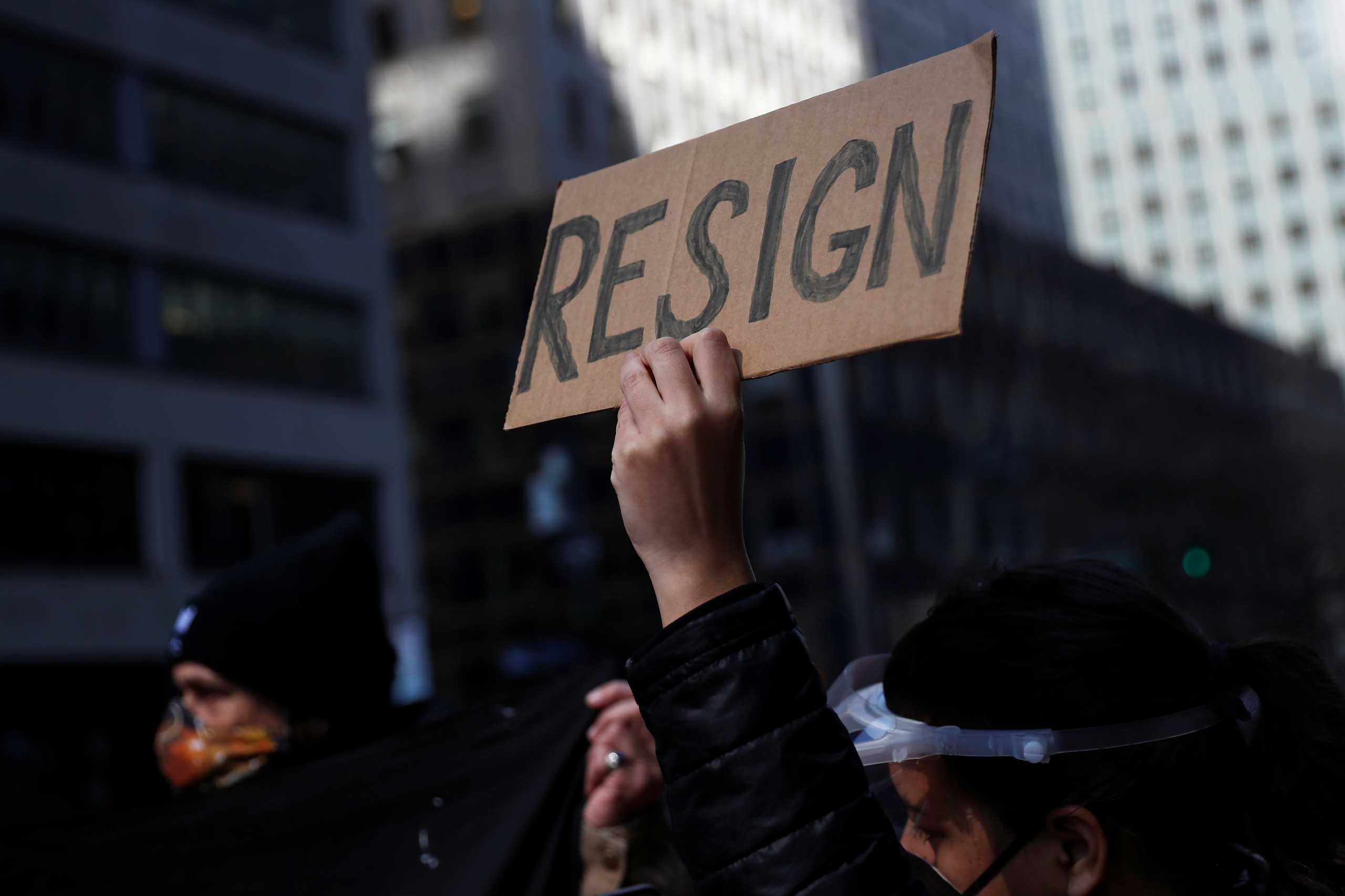 Demonstrators block 3rd avenue outside the New York Governor Andrew Cuomo's office calling for his resignation, in the Manhattan borough of New York, U.S. March 10, 2021. REUTERS