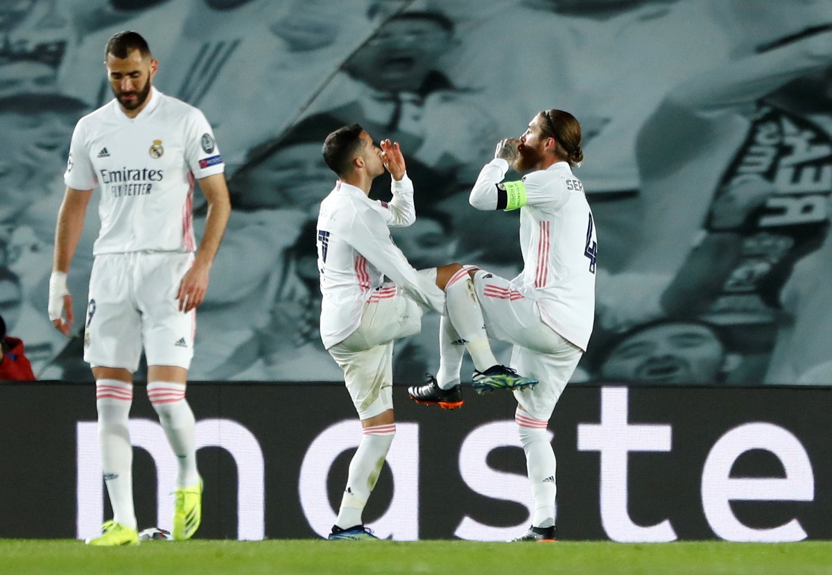 Soccer Football - Champions League - Round of 16 Second Leg - Real Madrid v Atalanta - Estadio Alfredo Di Stefano, Madrid, Spain - March 16, 2021 Real Madrid's Sergio Ramos celebrates scoring their second goal with teammates REUTERS