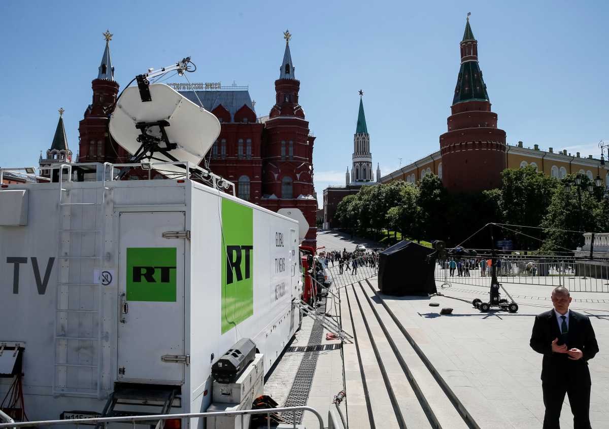 FILE PHOTO: Vehicles of Russian state-controlled broadcaster Russia Today (RT) are seen near the Red Square in central Moscow, Russia June 15, 2018. Picture taken June 15, 2018.  REUTERS