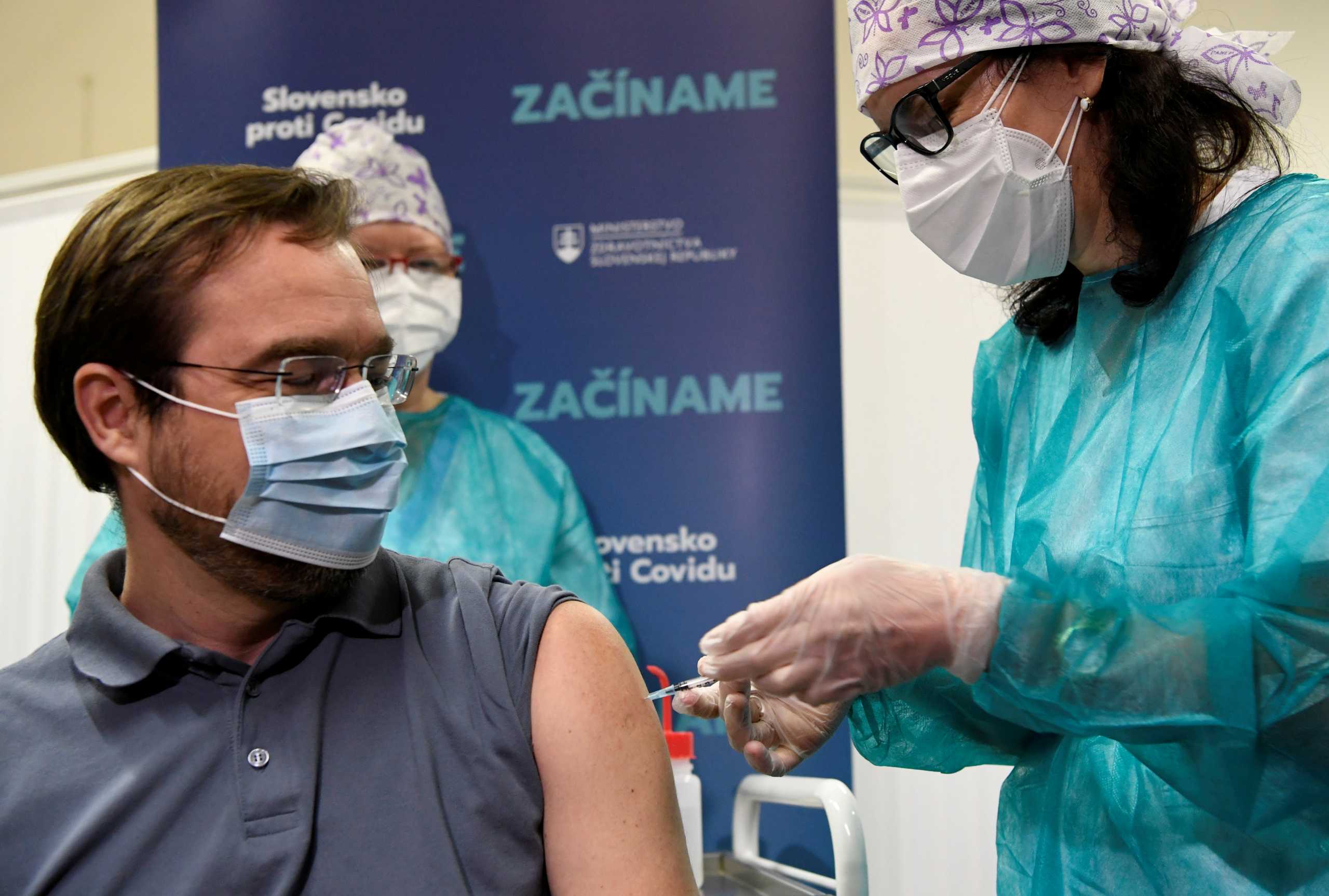 FILE PHOTO: Slovakia's Health Minister Marek Krajci receives an injection with a dose of Pfizer-BioNTech COVID-19 vaccine at the University Hospital, as the coronavirus disease (COVID-19) outbreak continues, in Nitra, Slovakia, December 26, 2020. REUTERS