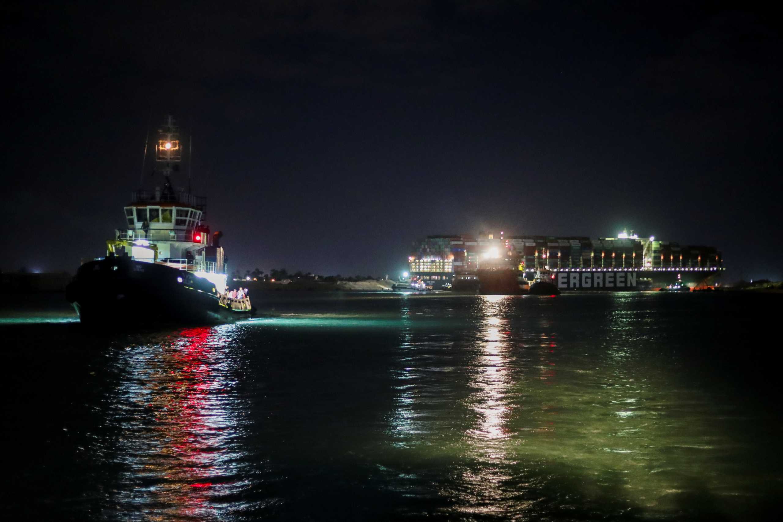 A view shows the stranded container ship Ever Given in the background, one of the world's largest container ships, after it ran aground, in Suez Canal, Egypt March 27, 2021. REUTERS