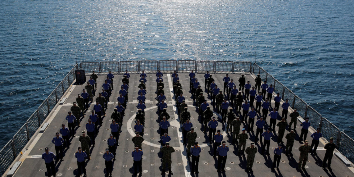 FILE PHOTO: Crew members of the amphibious landing ship tank (LST) TCG Bayraktar (L-402) pose after a landing drill during the Blue Homeland naval exercise off the Aegean coastal town of Foca in Izmir Bay, Turkey March 5, 2019. REUTERS
