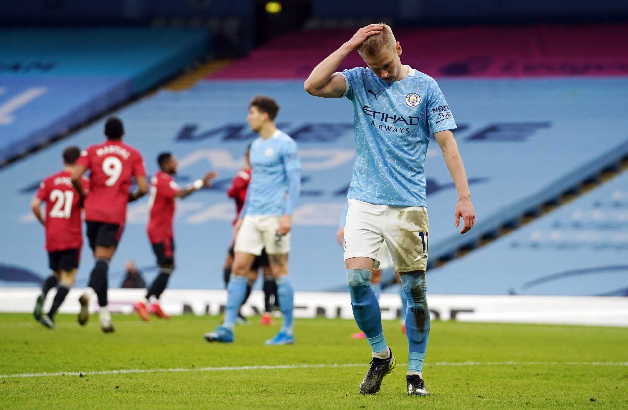 Soccer Football - Premier League - Manchester City v Manchester United - Etihad Stadium, Manchester, Britain - March 7, 2021 Manchester City's Oleksandr Zinchenko reacts after conceding their second goal score by Manchester United's Luke Shaw Pool via REUTERS