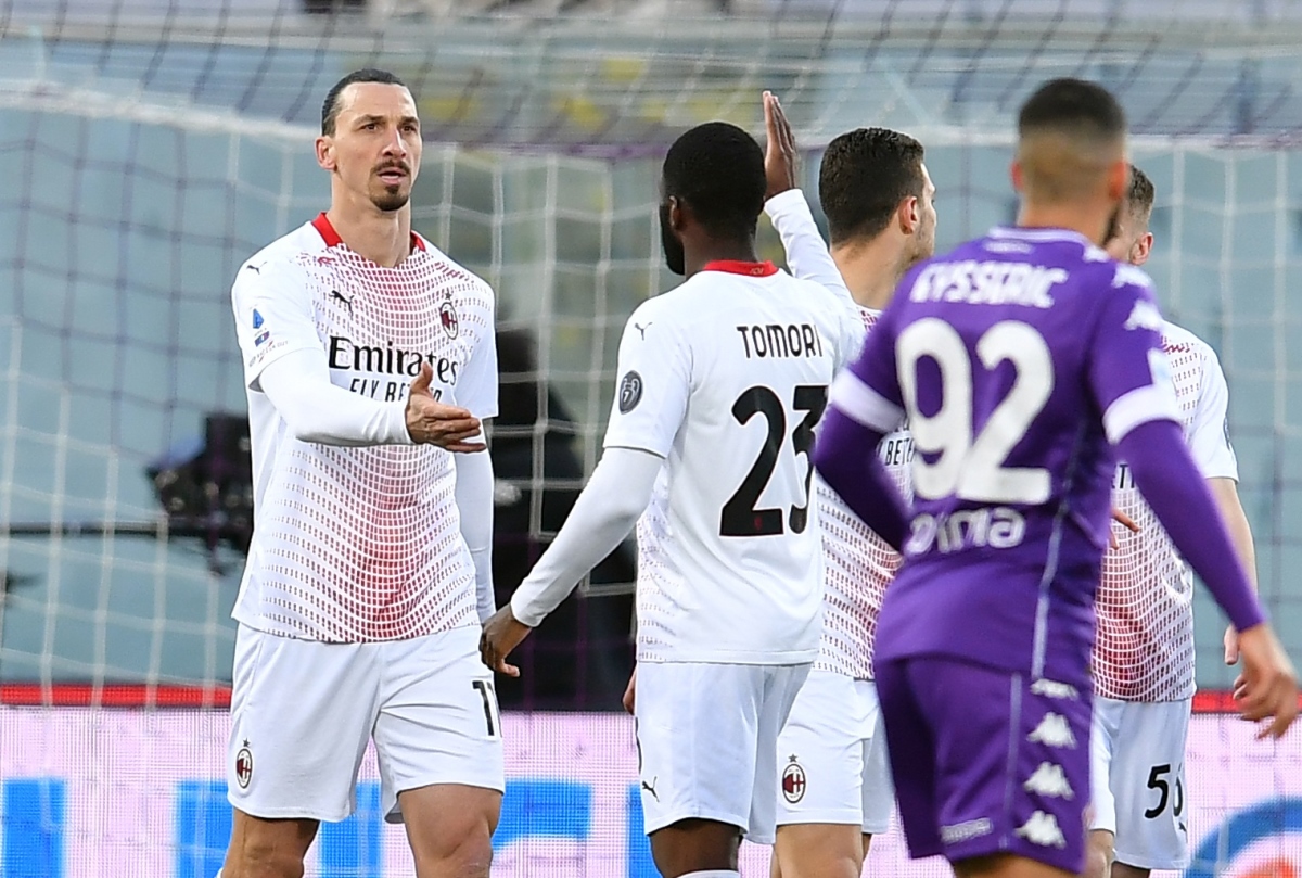 Soccer Football - Serie A - Fiorentina v AC Milan - Stadio Artemio Franchi, Florence, Italy - March 21, 2021 AC Milan's Zlatan Ibrahimovic celebrates scoring their first goal with Fikayo Tomori REUTERS