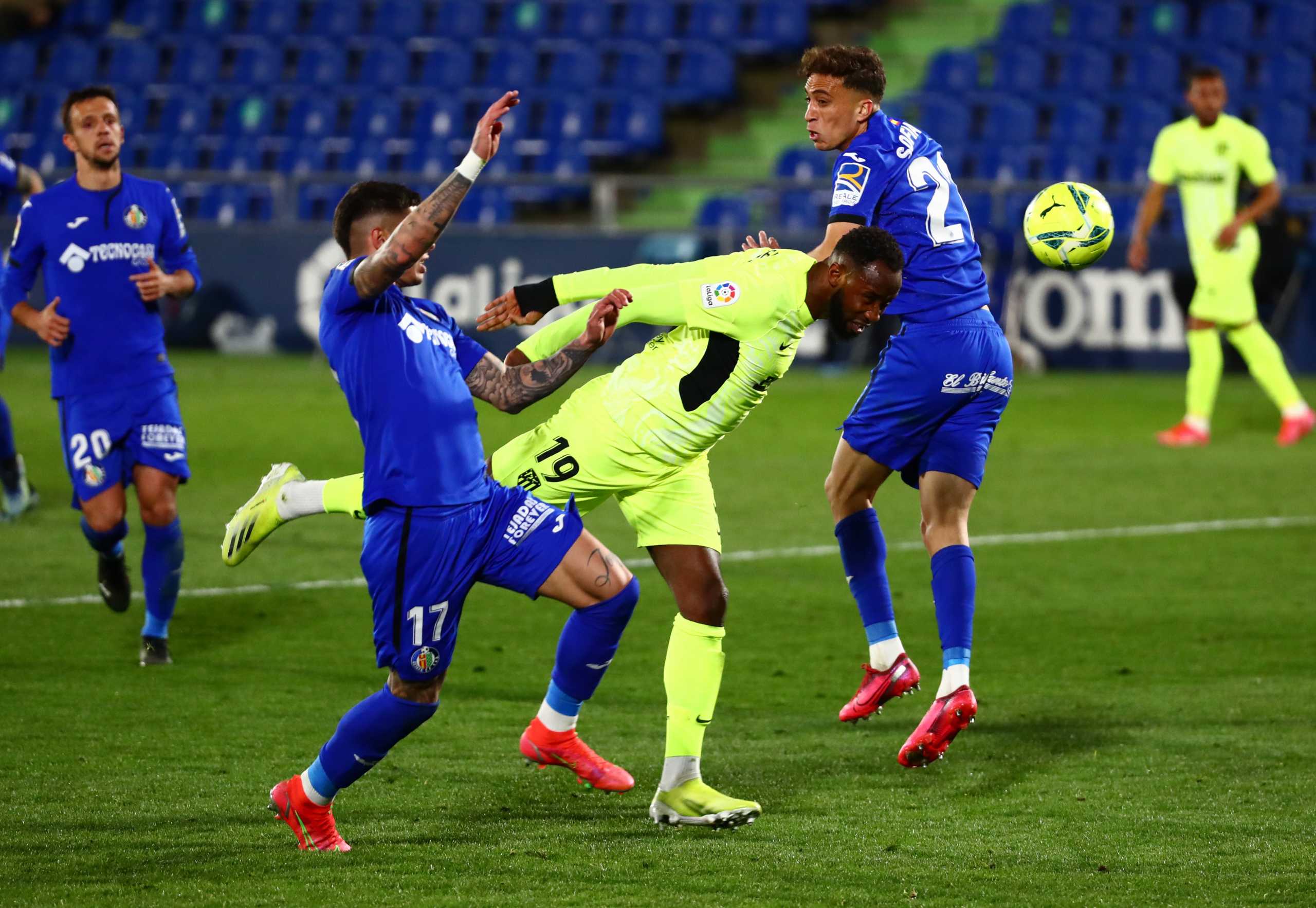 Soccer Football - La Liga Santander - Getafe v Atletico Madrid - Coliseum Alfonso Perez, Getafe, Spain - March 13, 2021 Atletico Madrid's Moussa Dembele in action with Getafe's Mathias Olivera REUTERS
