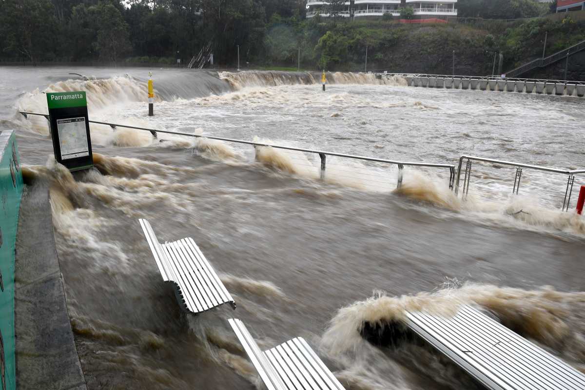 The swollen Parramatta River is seen overflowing as the state of New South Wales experiences heavy rains, in Sydney, Australia, March 20, 2021.  AAP Image