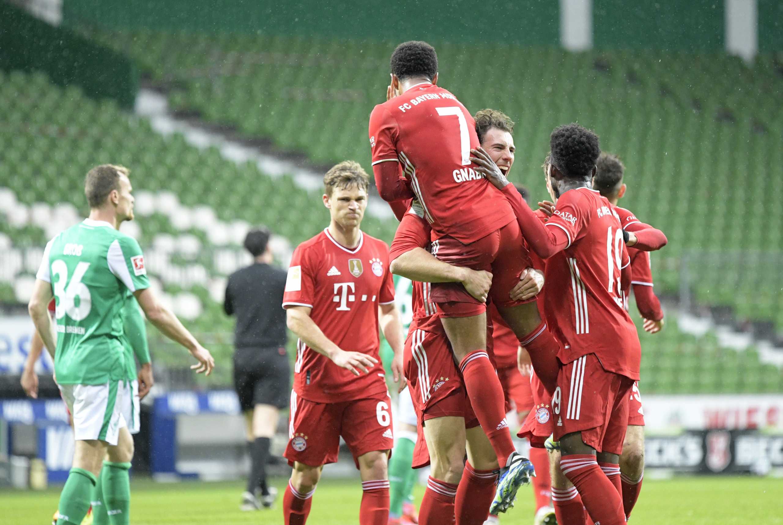 Soccer Football - Bundesliga - Werder Bremen v Bayern Munich - Weser-Stadion, Bremen, Germany - March 13, 2021 Bayern Munich's Serge Gnabry celebrates scoring their second goal with teammates Pool via REUTERS