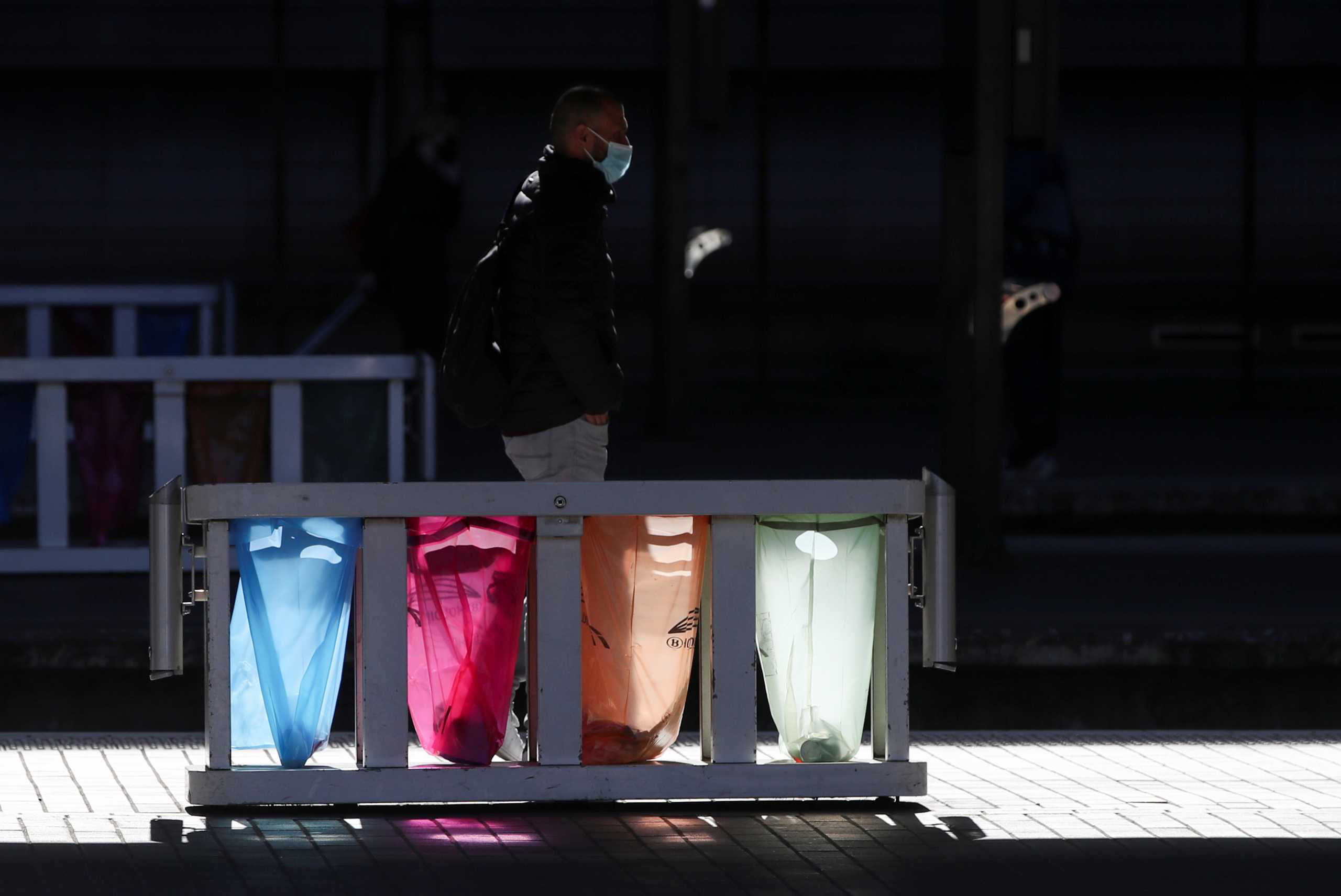 A passenger waits on an empty platform at Midi railway station during a 24-hour national strike in Brussels, Belgium March 29, 2021. REUTERS