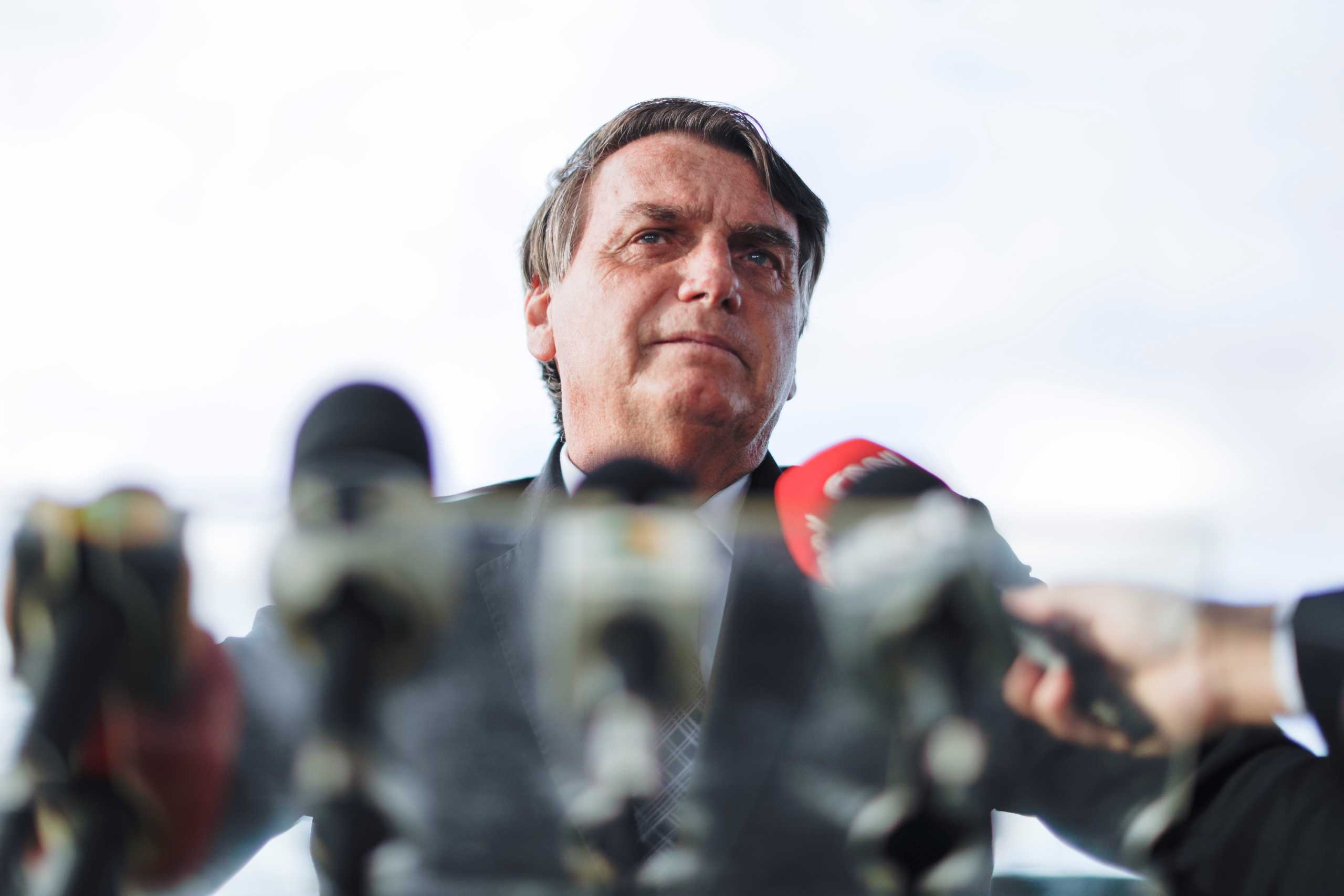 Brazil's President Jair Bolsonaro speaks to the media as he arrives at the Alvorada Palace, amid the coronavirus disease (COVID-19) outbreak, in Brasilia, Brazil, March 10, 2021. REUTERS