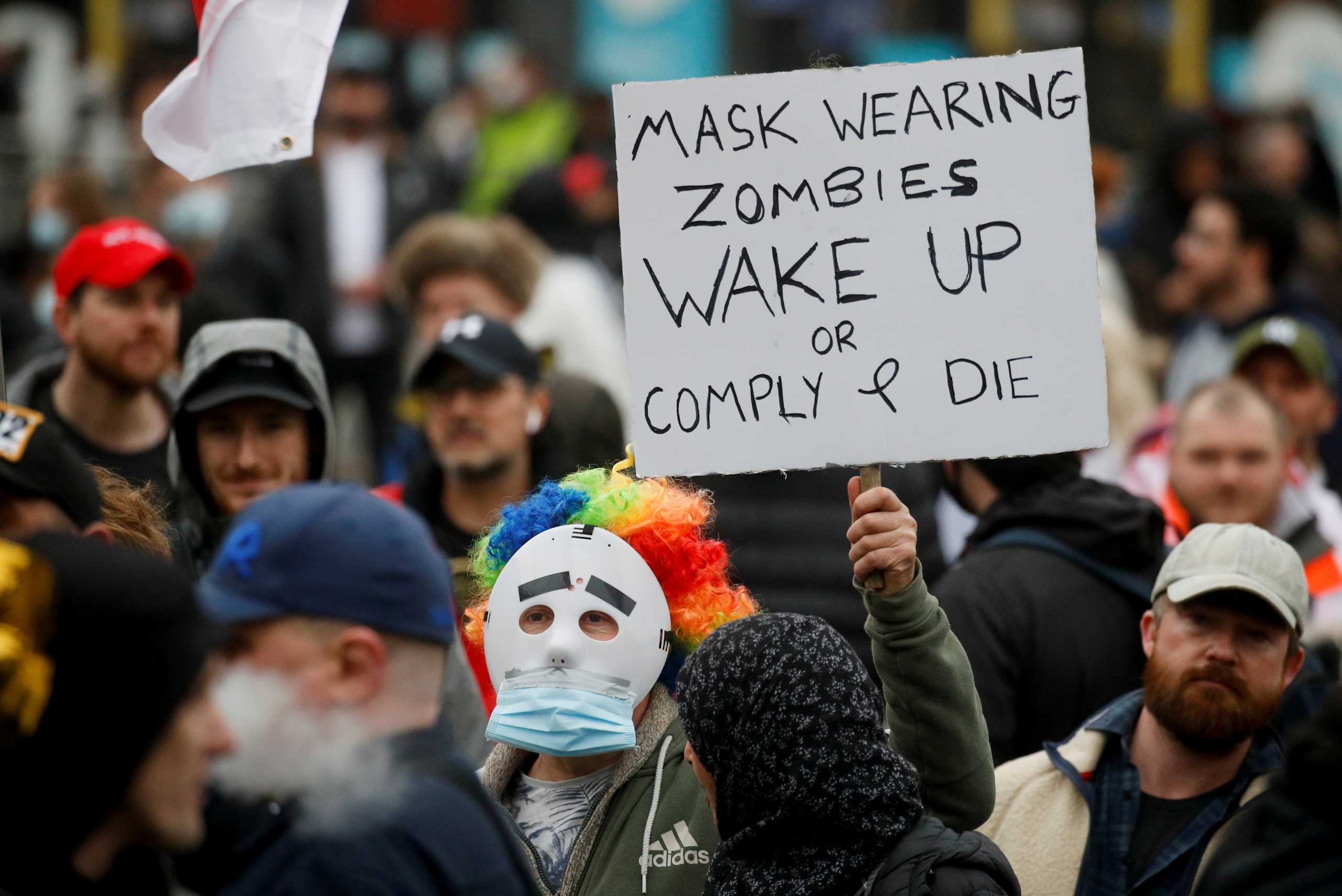 People participate in a protest against the lockdown, amid the spread of the coronavirus disease (COVID-19), in Manchester, Britain March 20, 2021. REUTERS