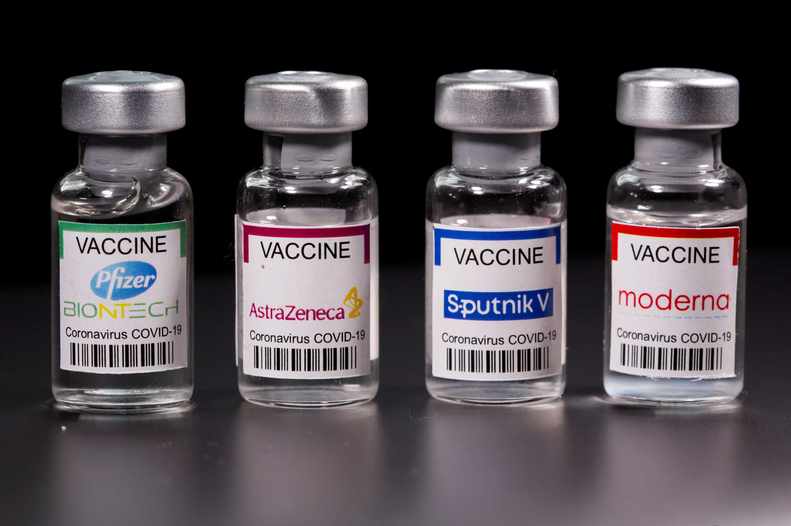 FILE PHOTO: Vials with Pfizer-BioNTech, AstraZeneca, Sputnik V, and Moderna coronavirus disease (COVID-19) vaccine labels are seen in this illustration picture taken March 19, 2021. REUTERS