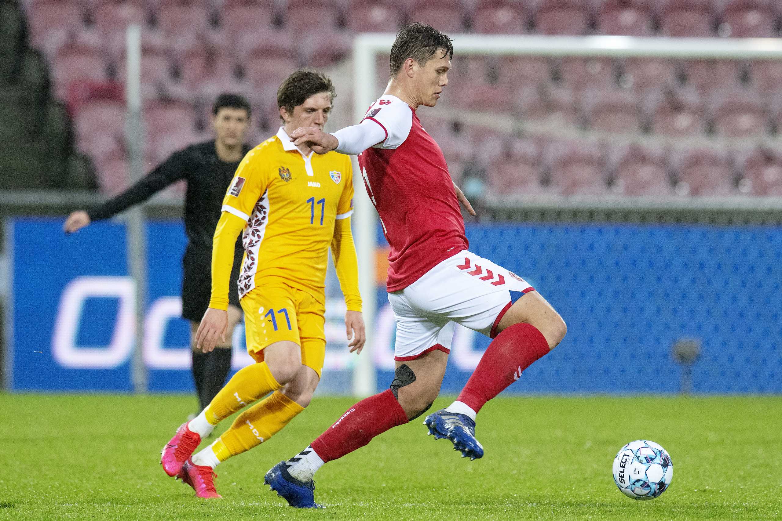 Soccer Football - World Cup Qualifiers Europe - Group F - Denmark v Moldova - MCH-Arena, Herning, Denmark - March 28, 2021 Denmark's Jannik Vestergaard in action with Moldova's Marius Iosipoi Ritzau Scanpix via REUTERS