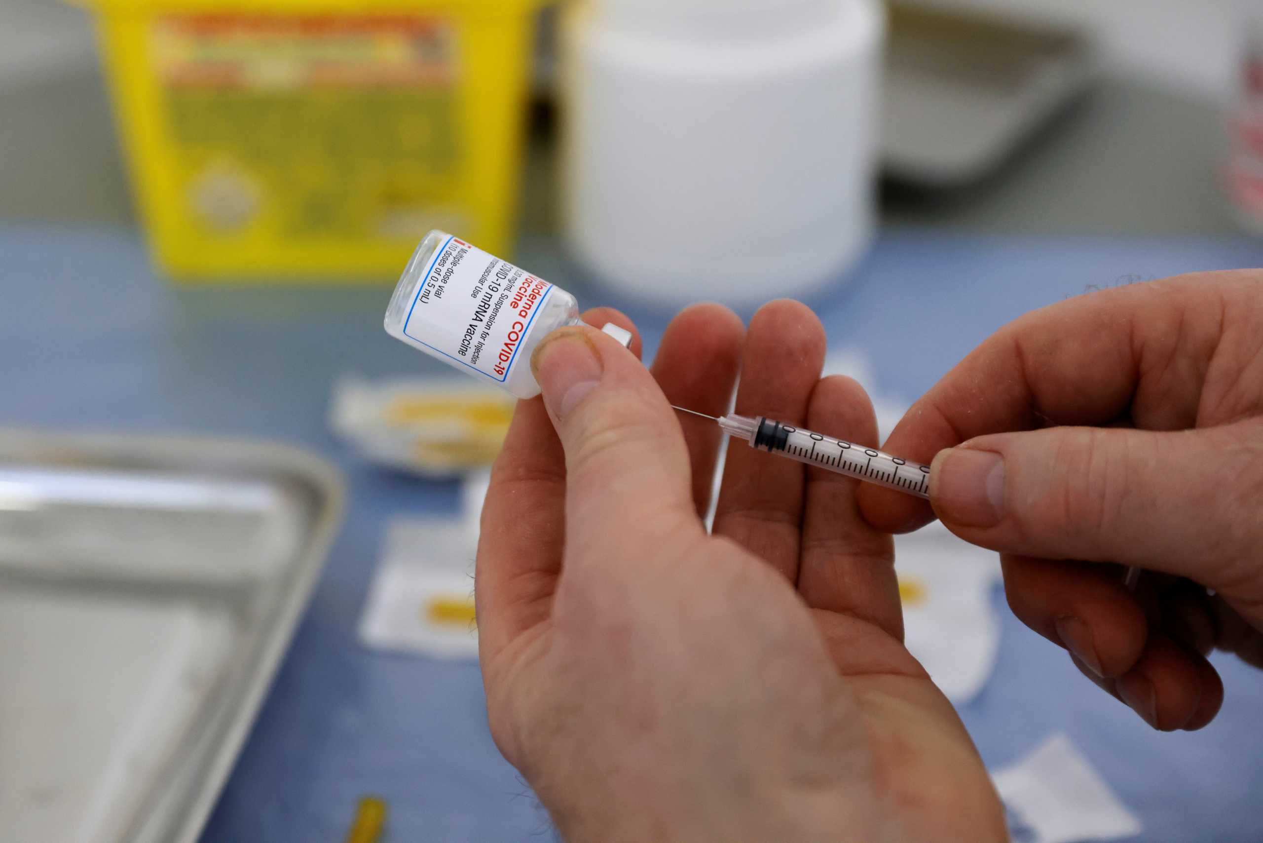A health worker prepares a syringe with a dose of the Moderna COVID-19 vaccine at a vaccination center in Calais as part of the coronavirus disease (COVID-19) vaccination campaign in France, March 4, 2021. REUTERS