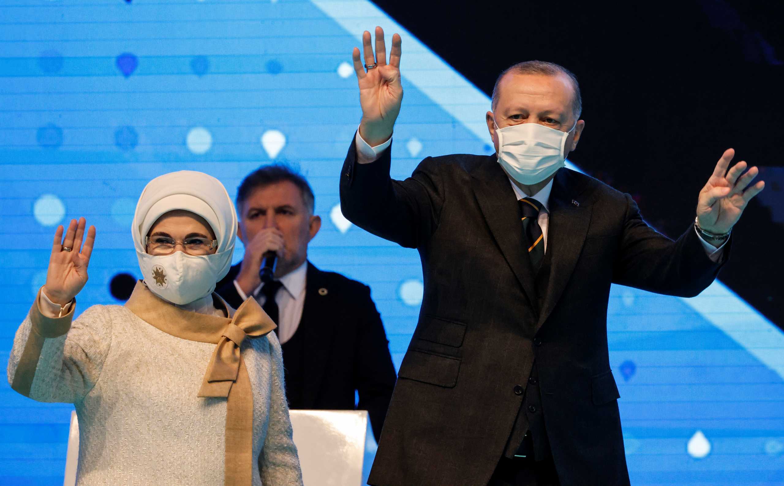 Turkish President Tayyip Erdogan and his wife Emine Erdogan greet their supporters during the Grand Congress of his ruling  AK Party in Ankara, Turkey, March 24, 2021. REUTERS