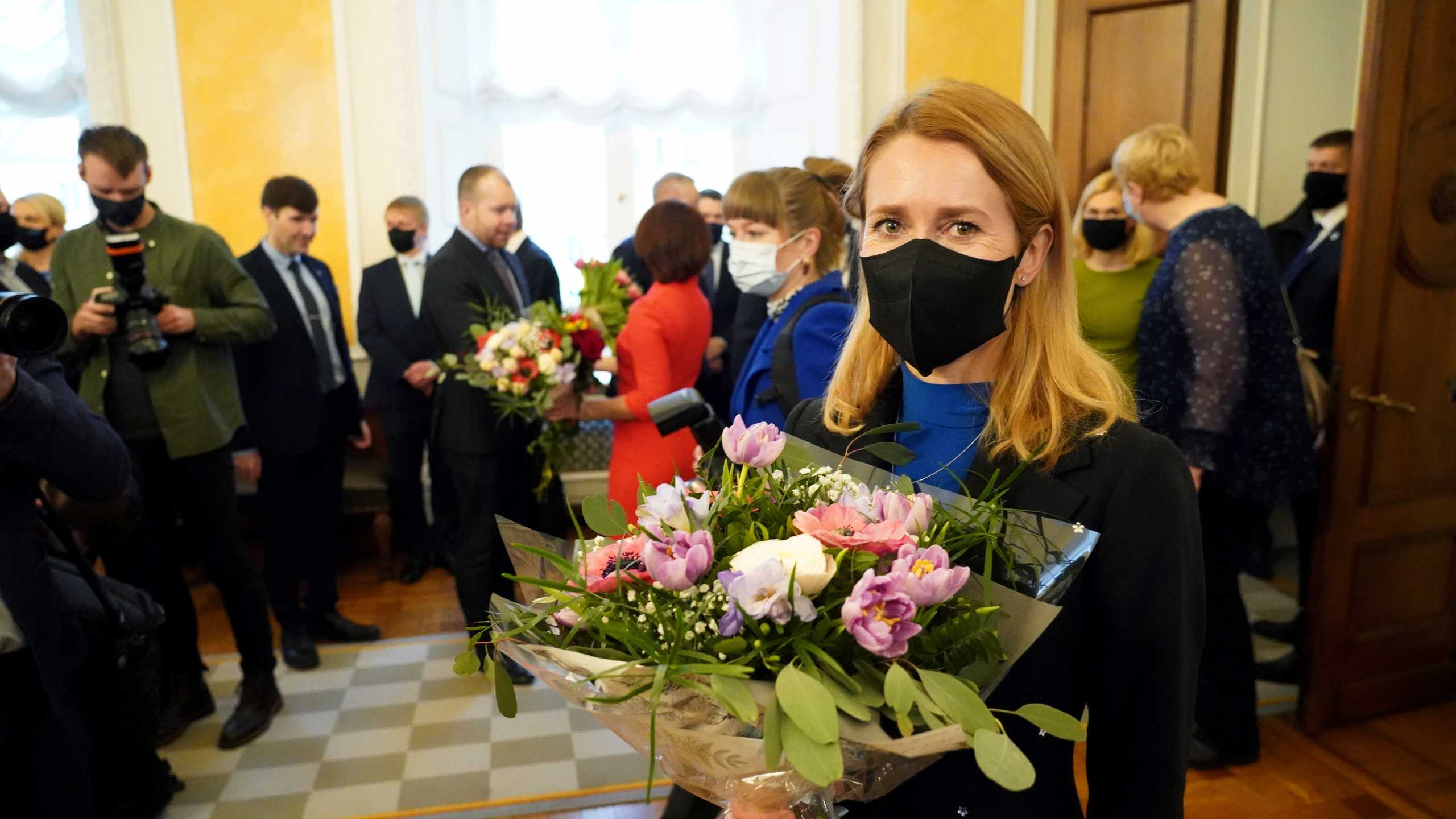 FILE PHOTO: Estonia's new Prime Minister Kaja Kallas holds a flower bouquet after giving an oath at the Parliament in Tallinn, Estonia Janurary 26, 2021. REUTERS