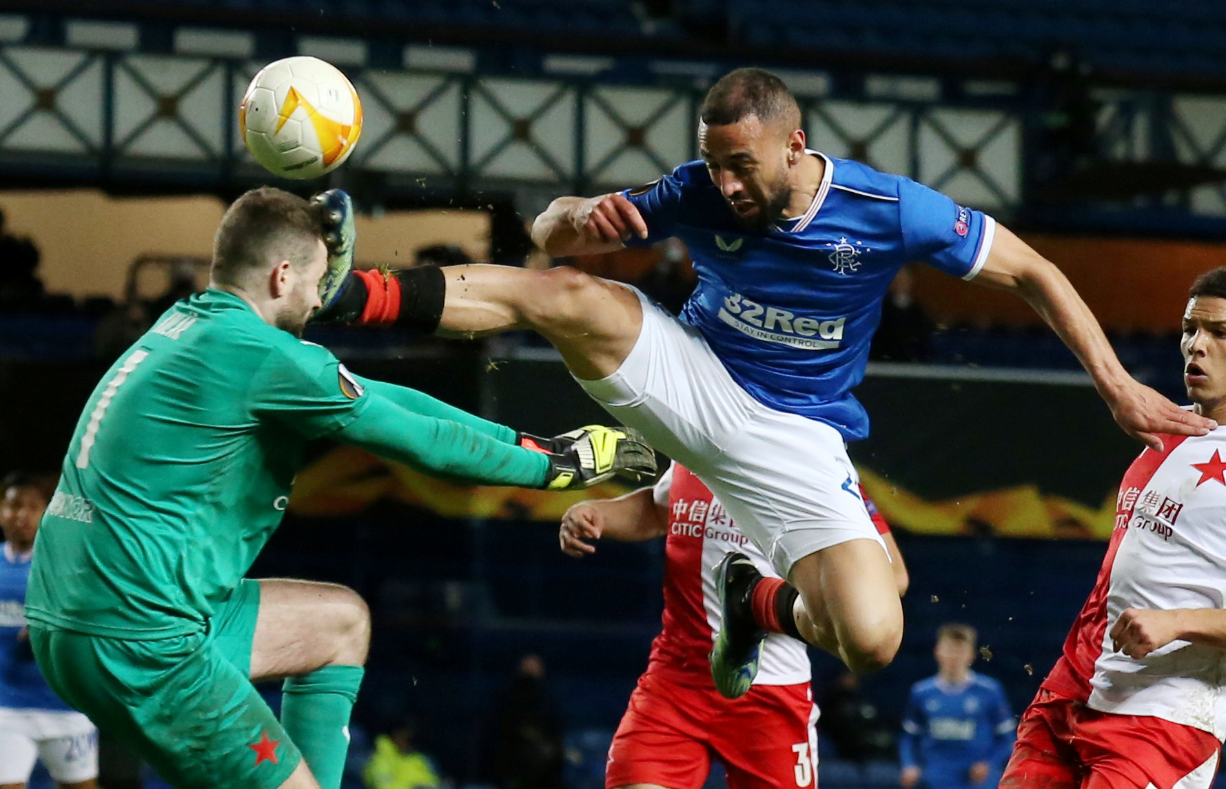 Soccer Football - Europa League - Round of 16 Second Leg - Rangers v Slavia Prague - Ibrox Stadium, Glasgow, Scotland, Britain - March 18, 2021  Rangers' Kemar Roofe clashes with Slavia Prague's Ondrej Kolar Pool via REUTERS